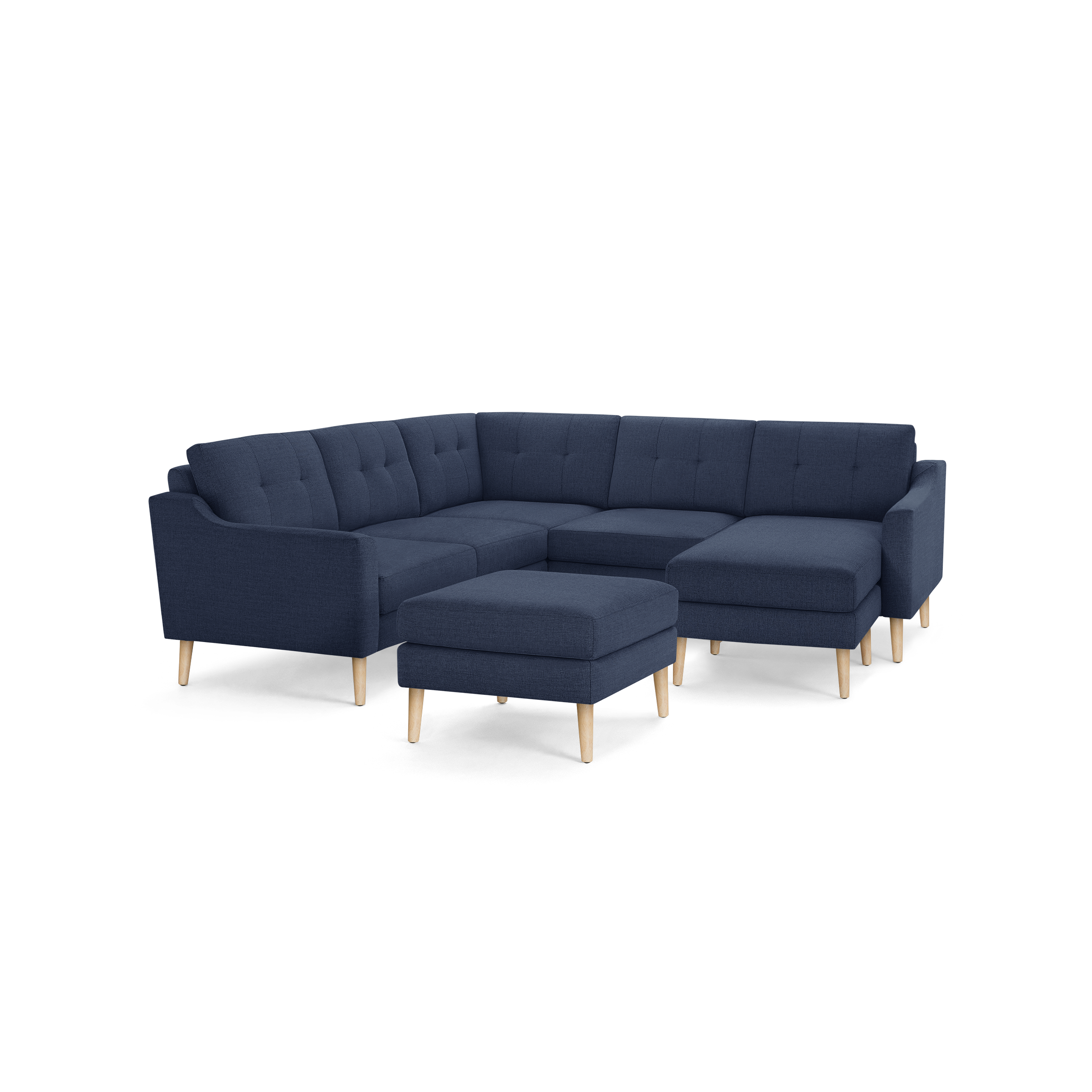 Modern navy blue fabric sectional sofa with tufted cushions, wooden legs, and matching ottoman, ideal for spacious living rooms.