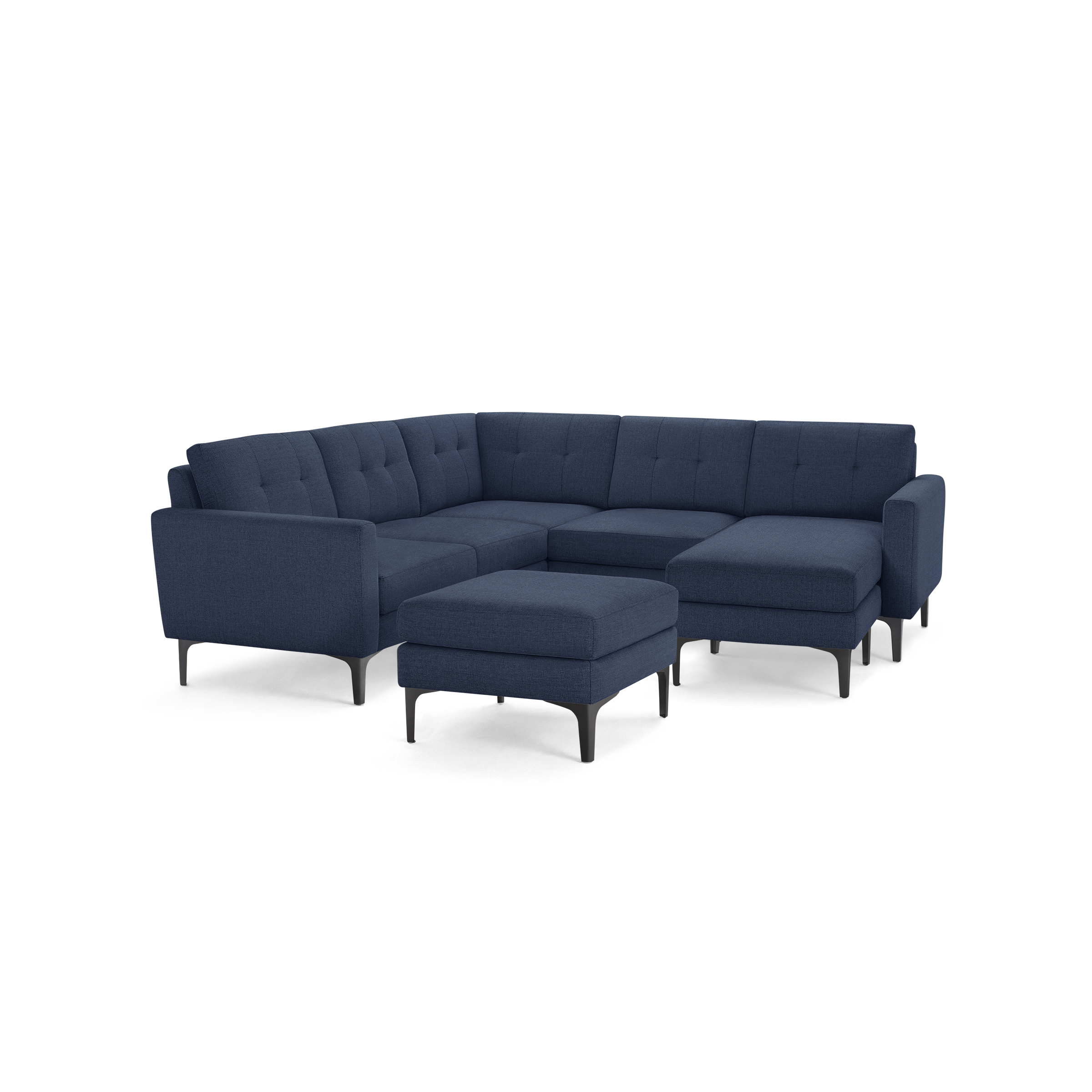 Modern navy blue fabric sectional sofa with tufted back cushions and matching ottoman on metal legs.