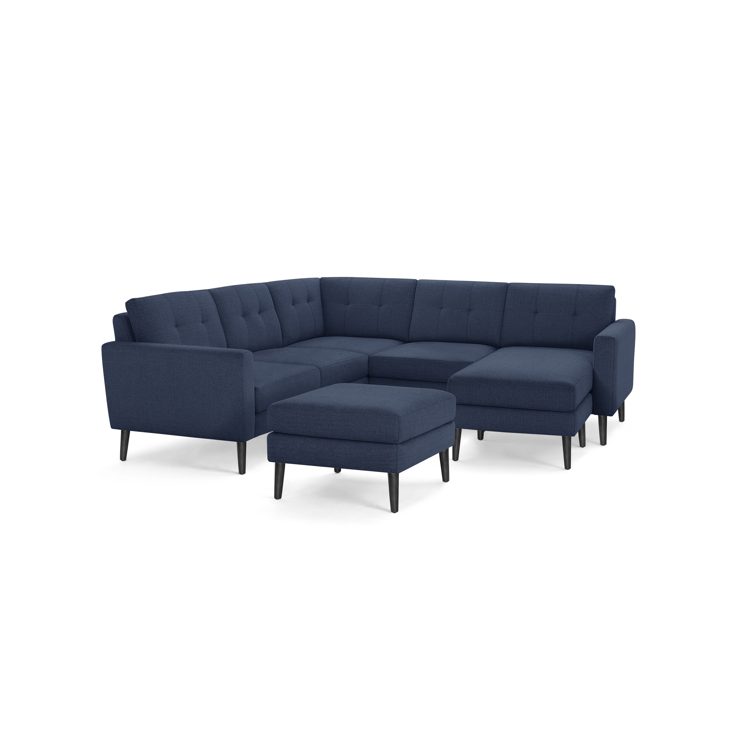 Mid-century modern navy blue fabric sectional sofa with black tapered wooden legs and matching ottoman.