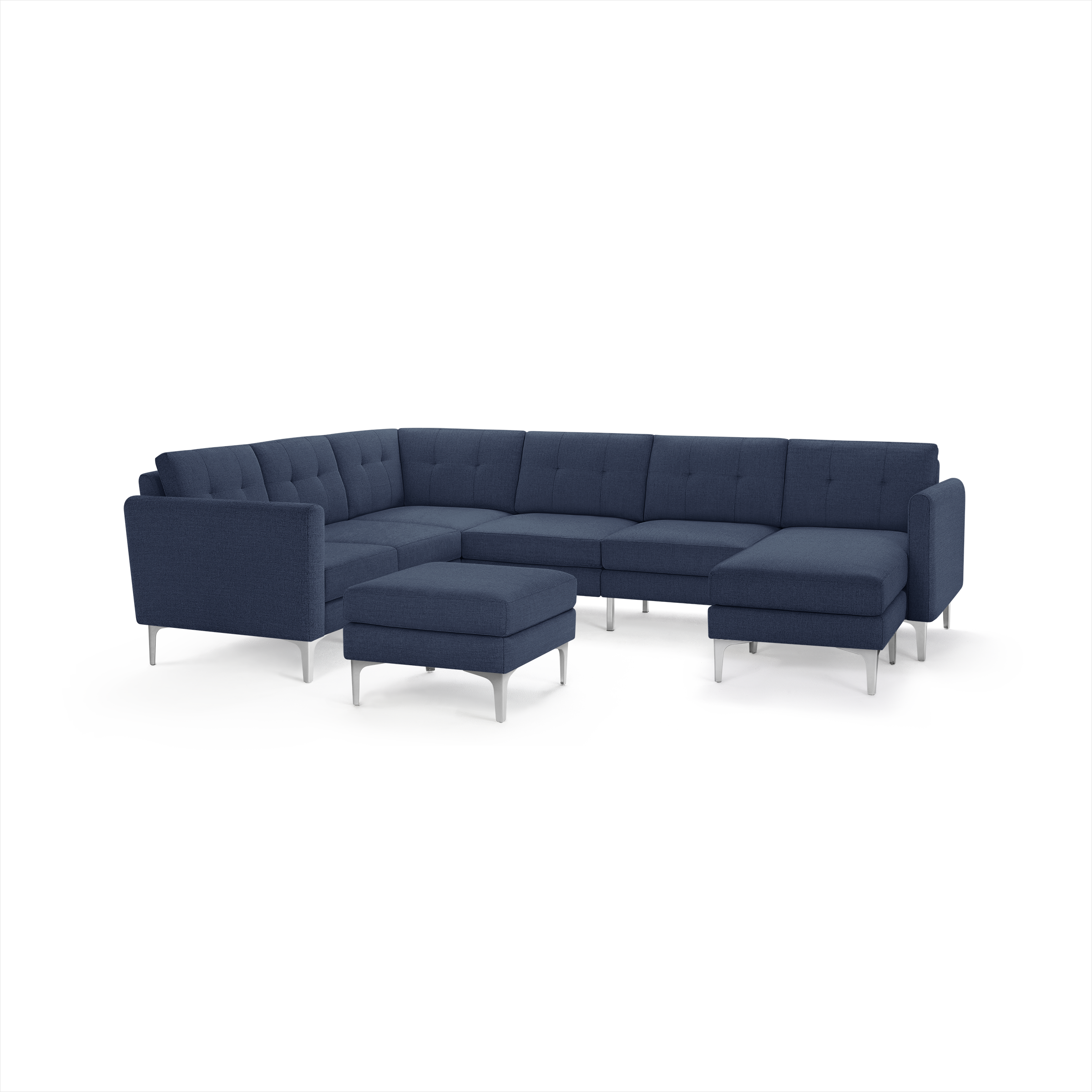 Modern navy blue sectional sofa with tufted cushions, metal legs, and a matching ottoman, designed for spacious comfort.