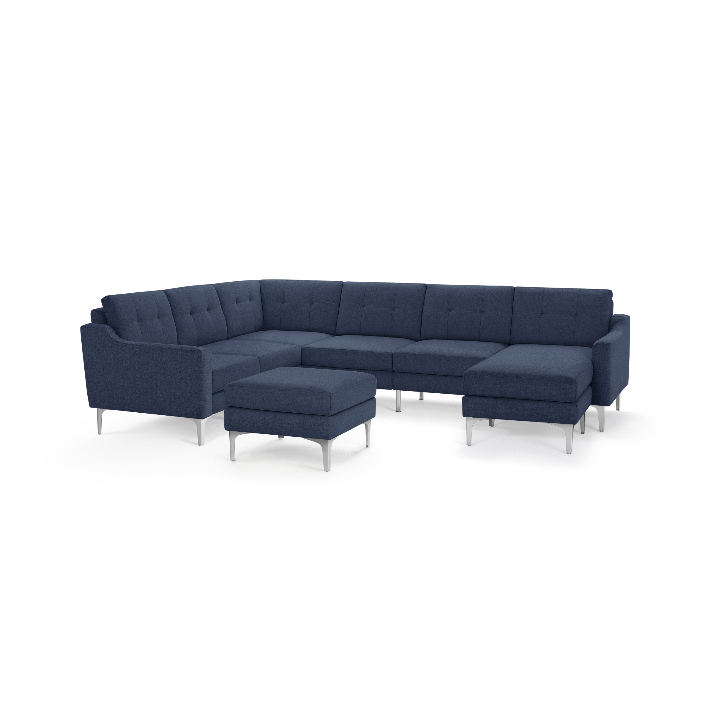 Modern navy blue fabric sectional sofa with tufted cushions, metal legs, and a matching ottoman, designed for spacious living areas.
