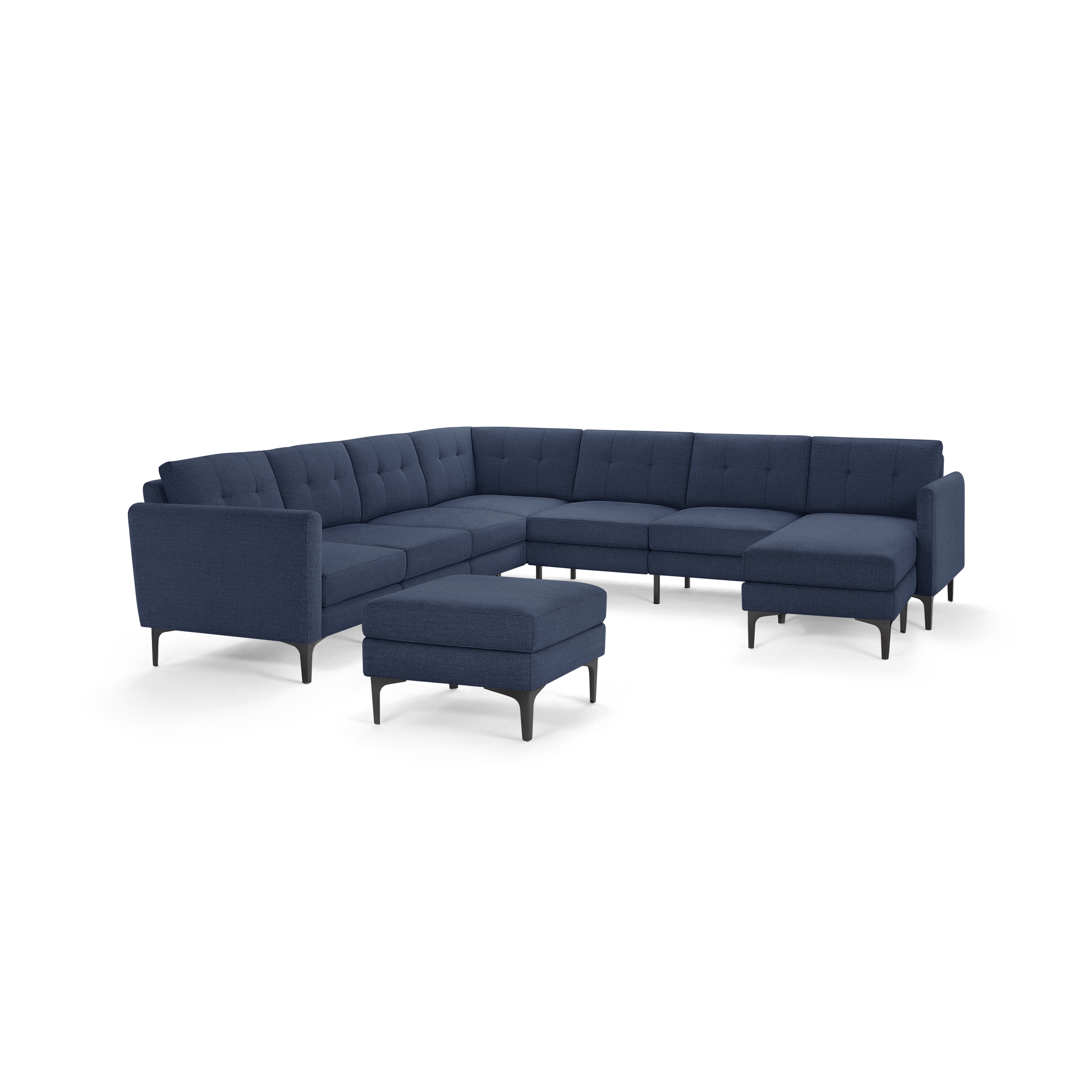 Modern deep blue fabric sectional sofa with tufted back cushions, metal legs, and a matching ottoman on a white background.