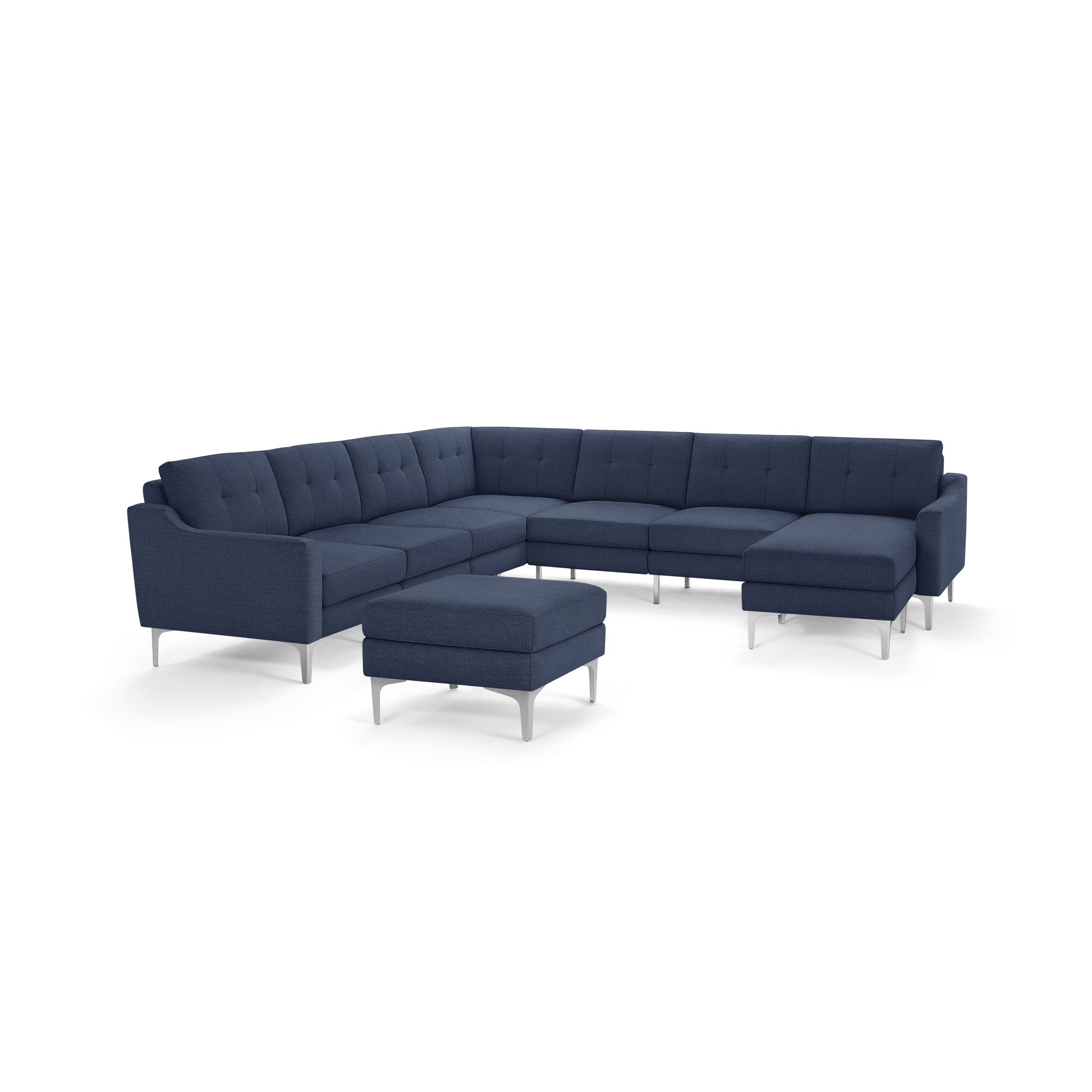 Modern L-shaped sectional sofa in dark blue fabric with tufted cushions and metal legs, includes matching ottoman.
