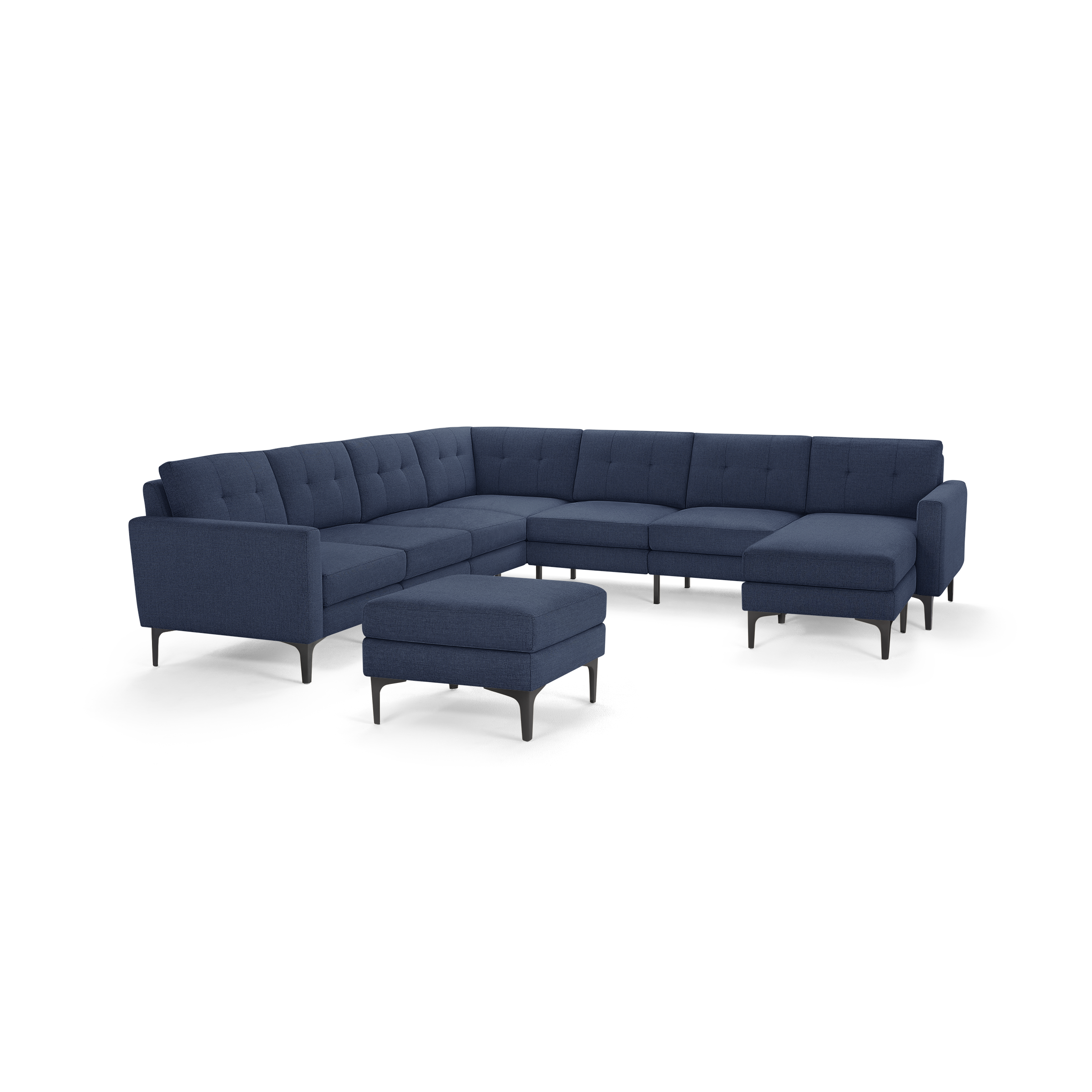 Modern navy blue fabric sectional sofa with tufted cushions, metal legs, and matching ottoman on a white background.