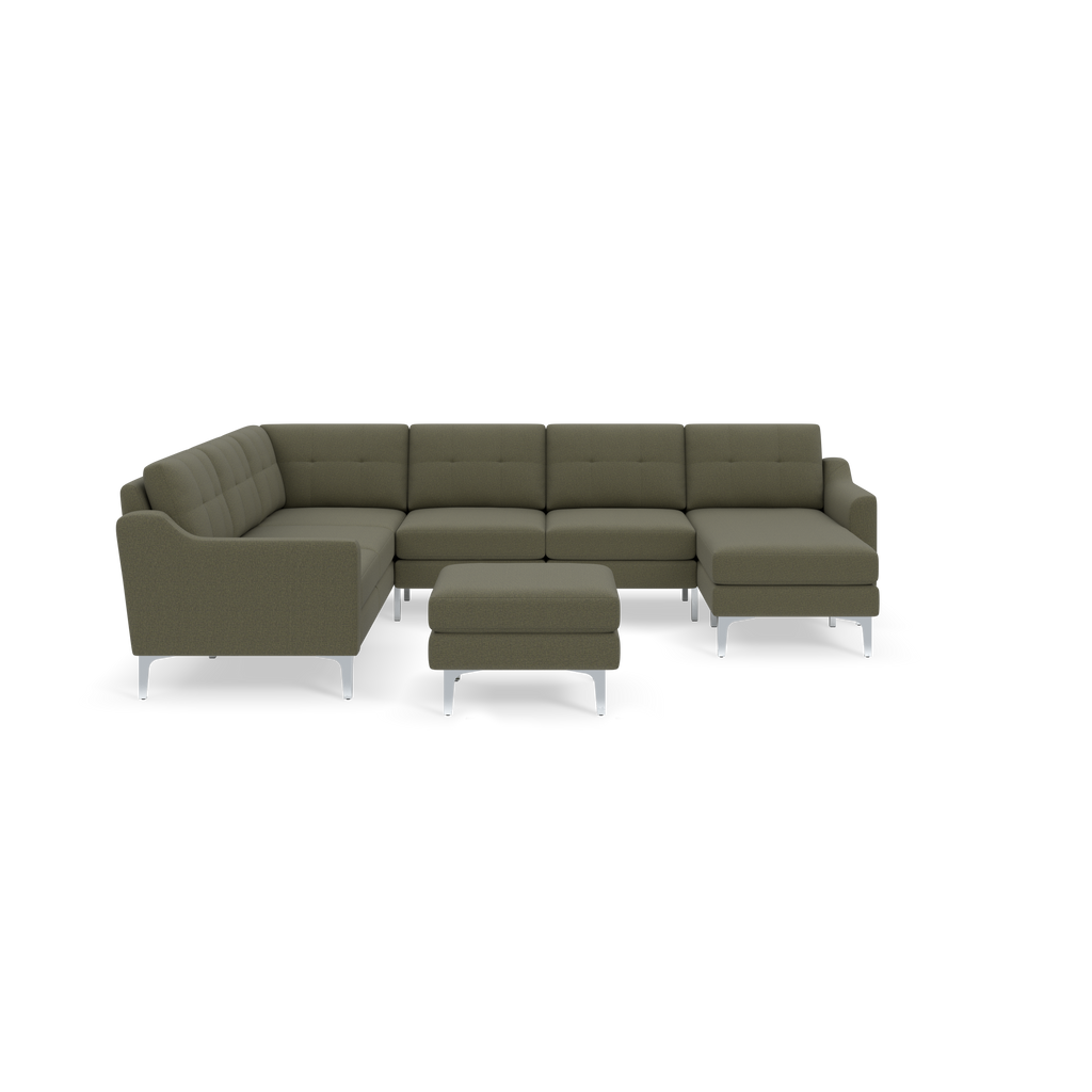 Moss green fabric sectional sofa with tufted back cushions and chrome legs, including a matching ottoman.