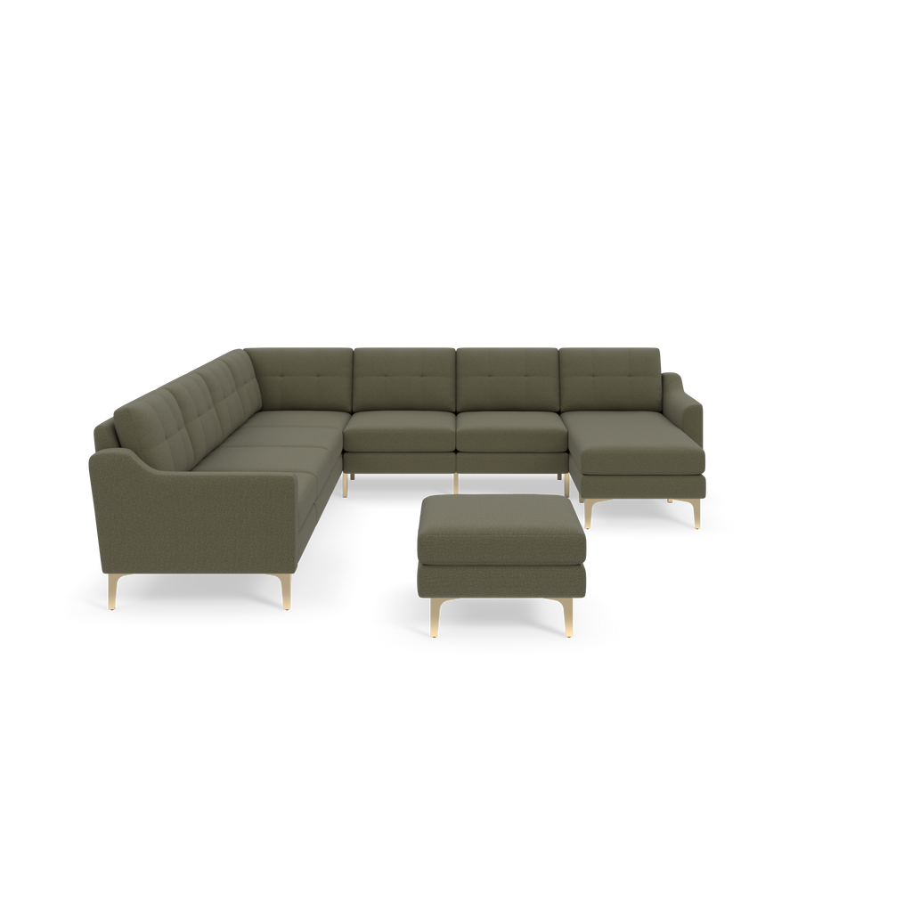 L-shaped Moss green sectional sofa with tufted back cushions and matching ottoman, supported by light wooden legs, isolated on black background.