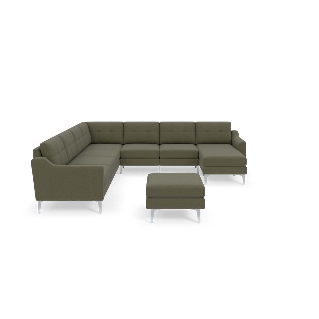 Moss green modern L-shaped sectional sofa with metal legs and matching ottoman against black background.