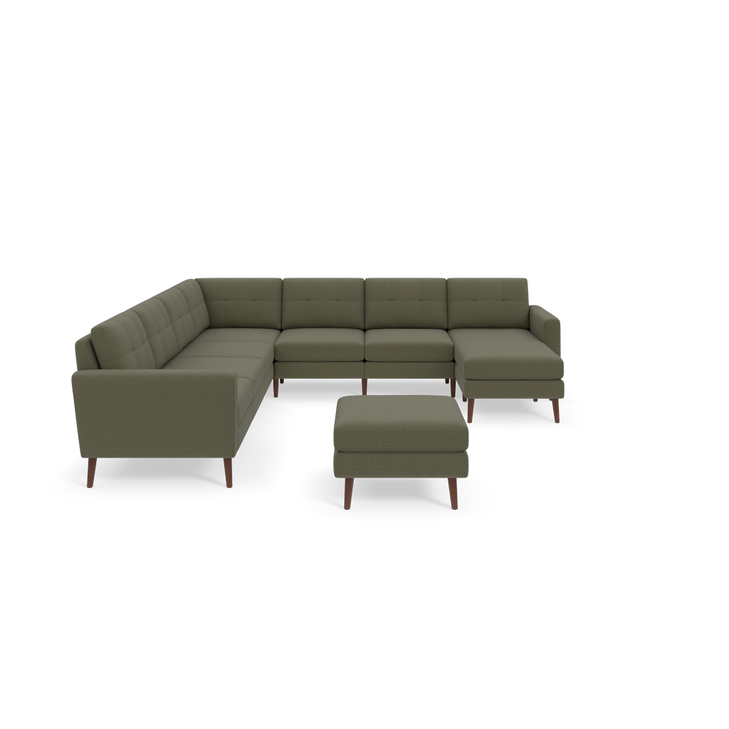Moss green L-shaped sectional sofa with tufted back cushions and matching ottoman, featuring wooden angled legs.