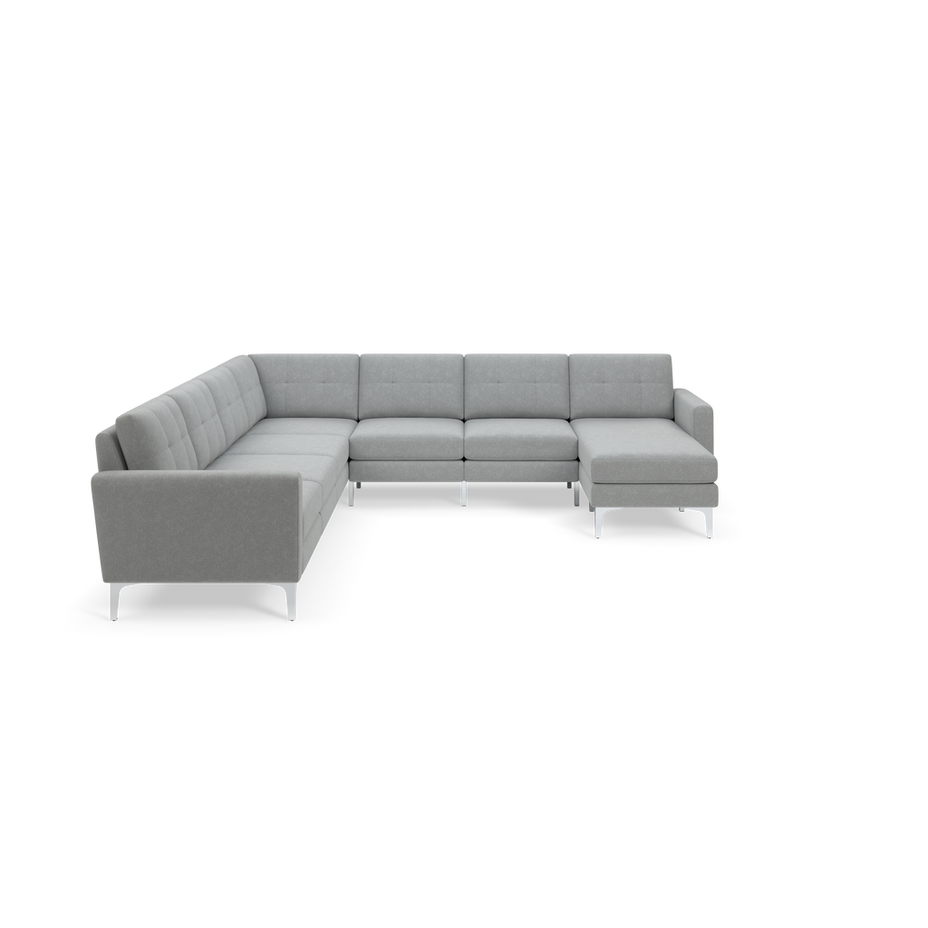 Modern light gray L-shaped sectional sofa with clean lines, metal legs, and tufted back cushions on a black background.