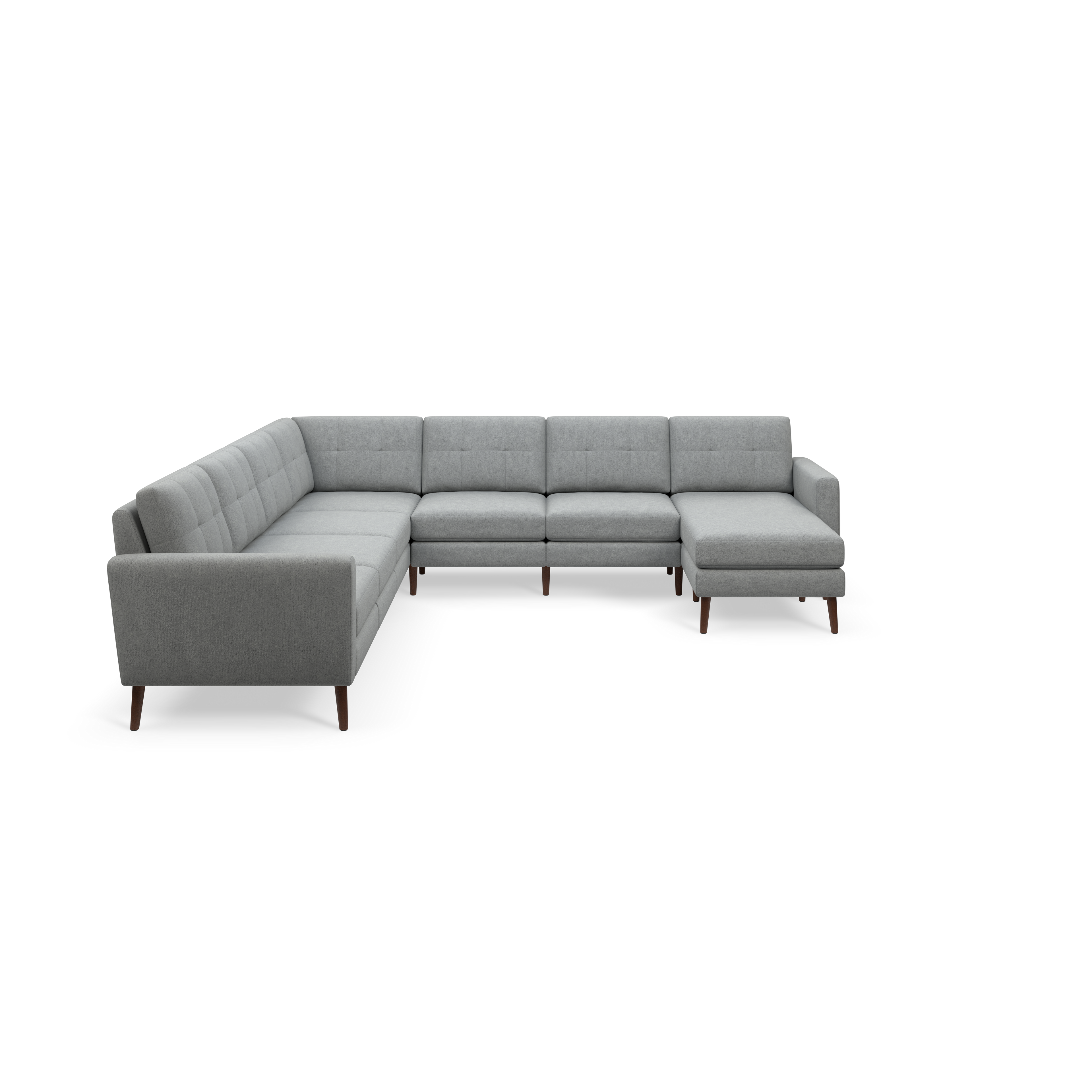 Gray modern sectional sofa with tufted cushions, wooden legs, and a chaise lounge on one end, isolated on black background.
