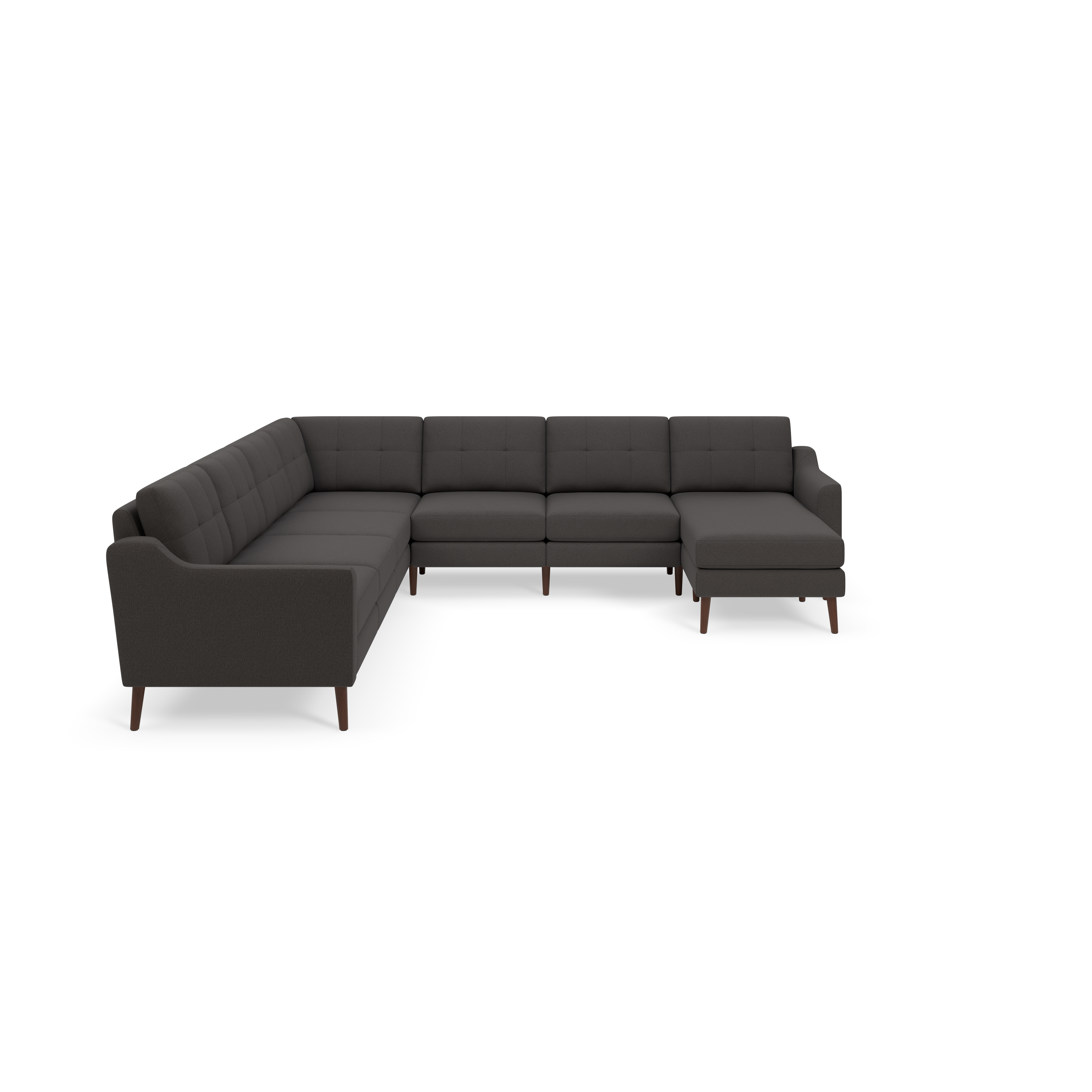 Dark gray L-shaped sectional sofa with tufted back cushions and wooden legs against black background.