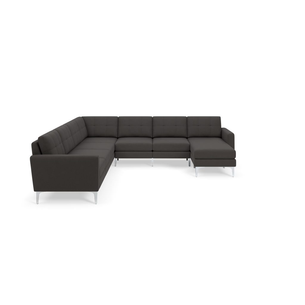Dark gray L-shaped sectional sofa with tufted back cushions and modern metal legs, designed for spacious seating.