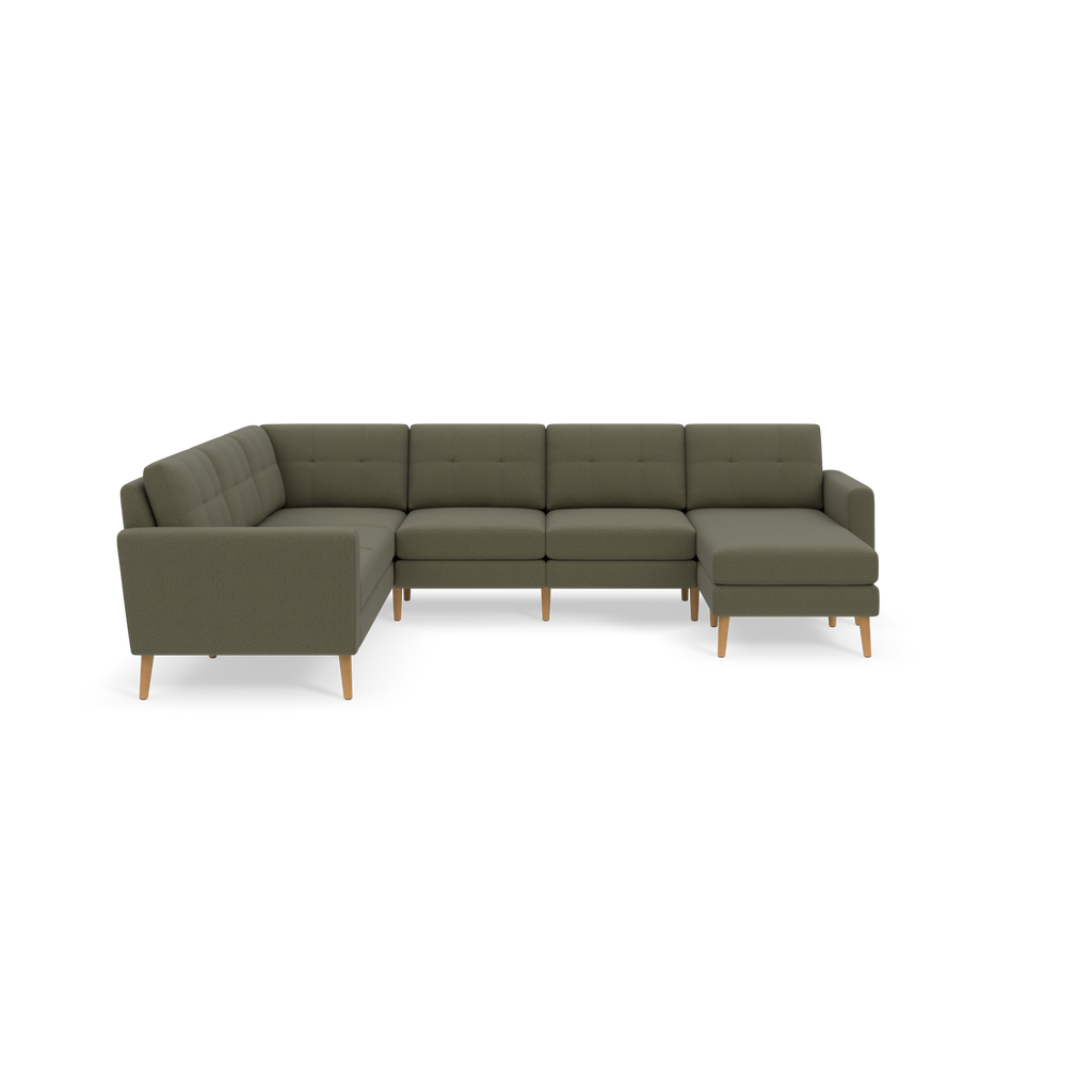 Large Moss green sectional sofa with tufted backrests and wooden legs, featuring an L-shaped design with a chaise lounge on the right side.