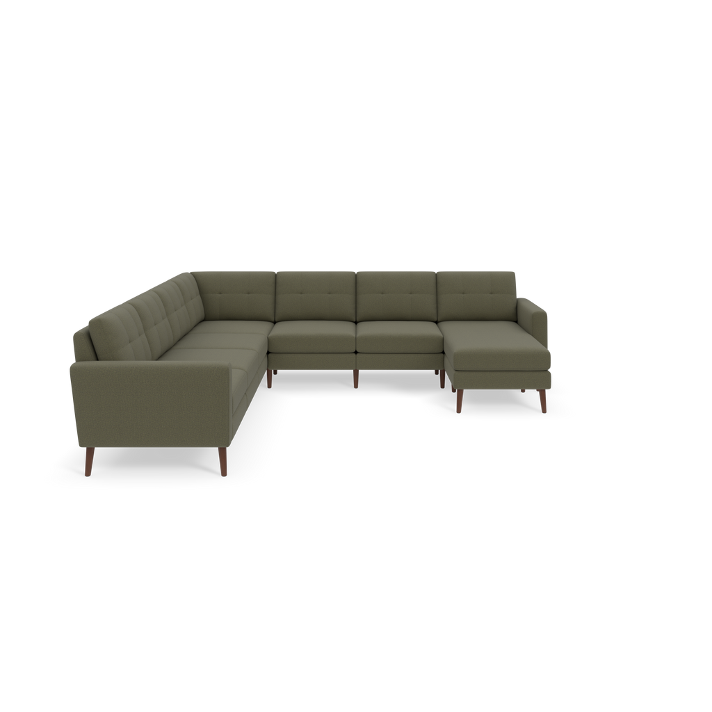 Large Moss green L-shaped sectional sofa with tufted back cushions and wooden legs on black background.