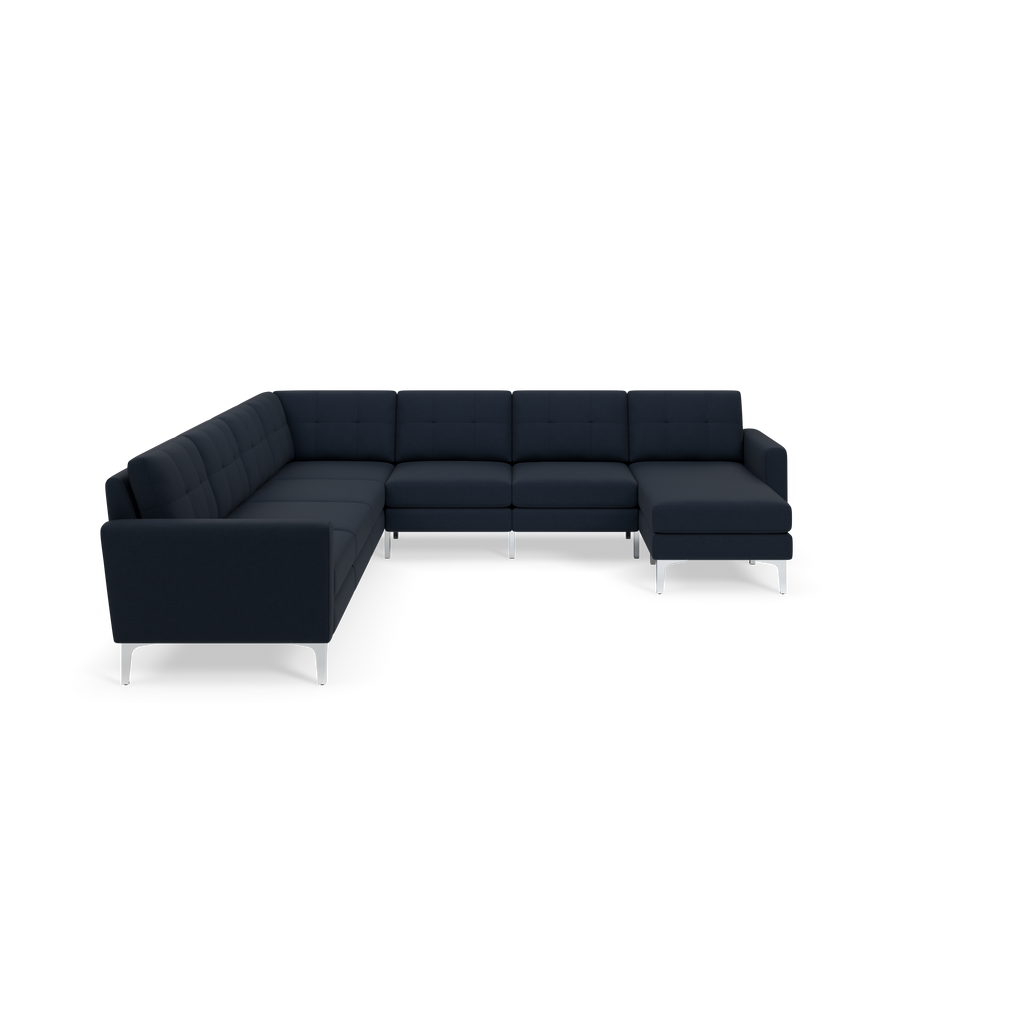 Modern L-shaped sectional sofa with dark navy fabric upholstery and silver metal legs, featuring tufted cushions and clean lines.