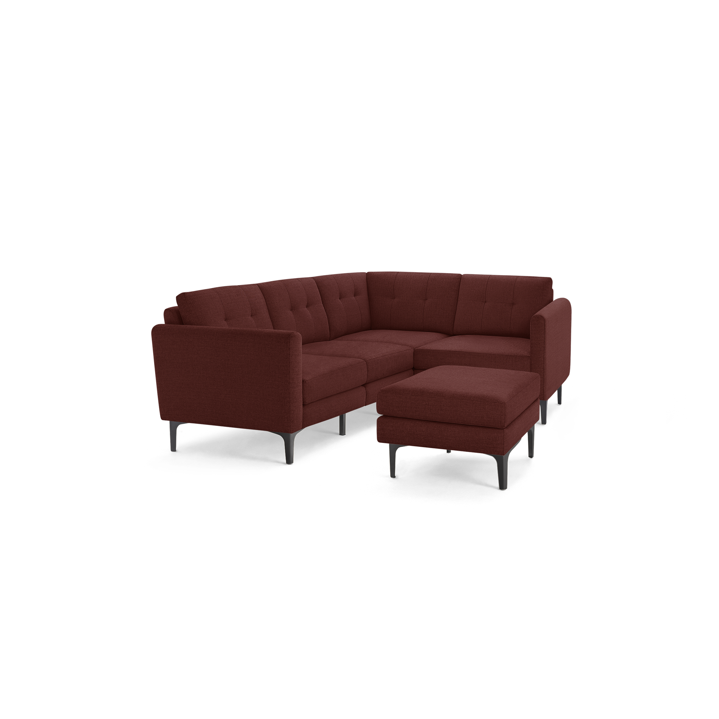 Modern L-shaped sectional sofa in deep red fabric with tufted backrests and matching ottoman on black metal legs.