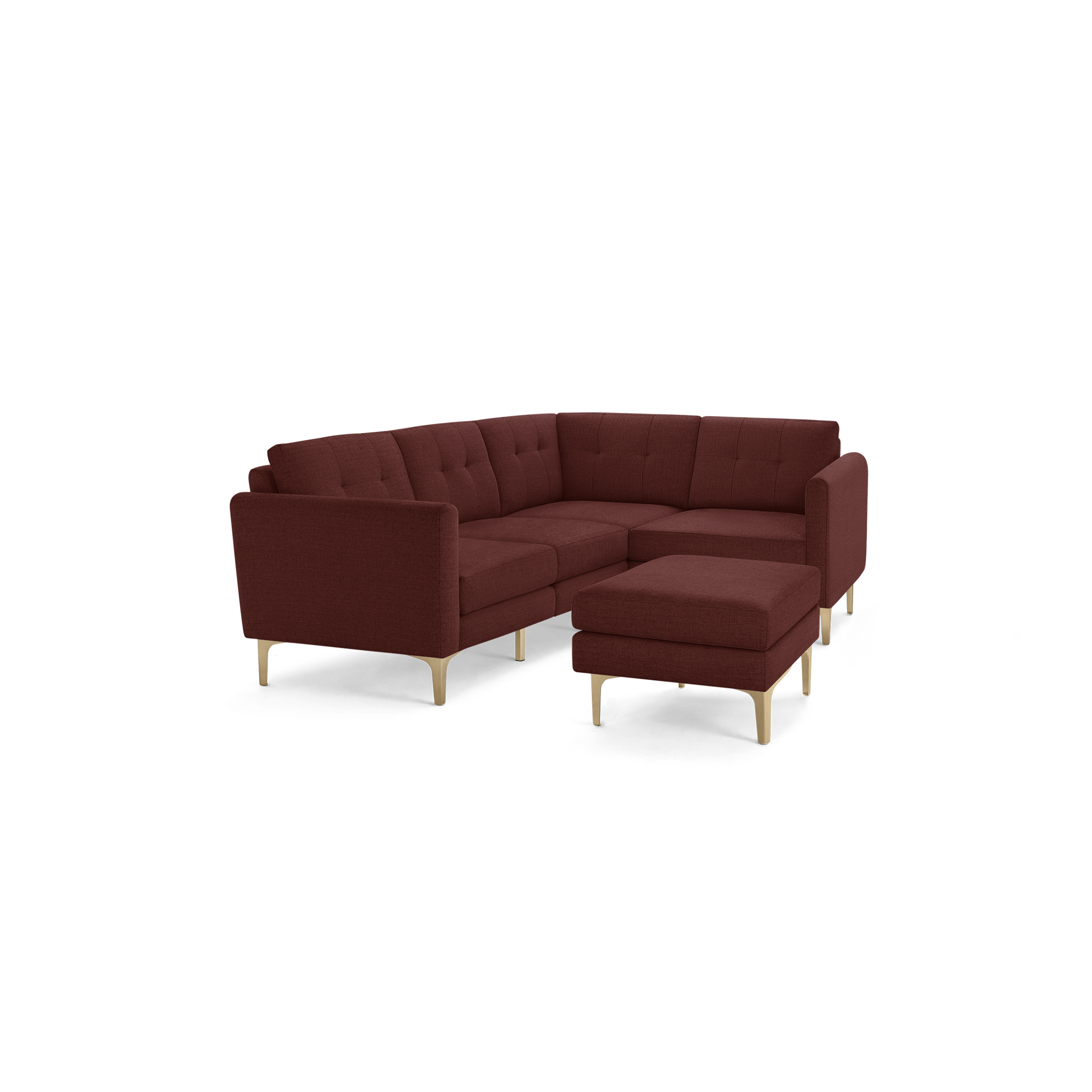 Modern L-shaped sectional sofa in deep red fabric with tufted back cushions and light wood legs, featuring a matching ottoman.