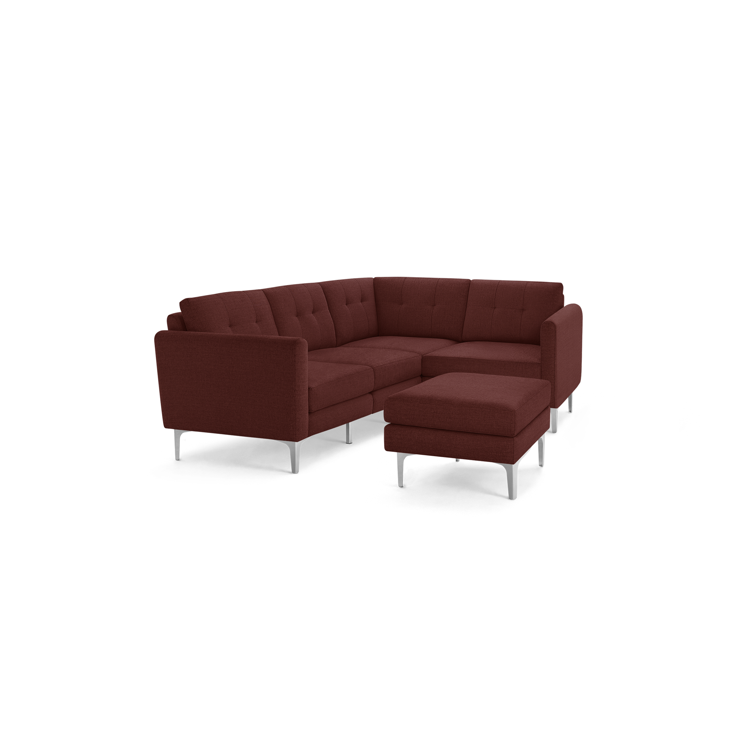 Modern L-shaped sectional sofa in deep red fabric with tufted cushions and silver metal legs, including a matching ottoman.