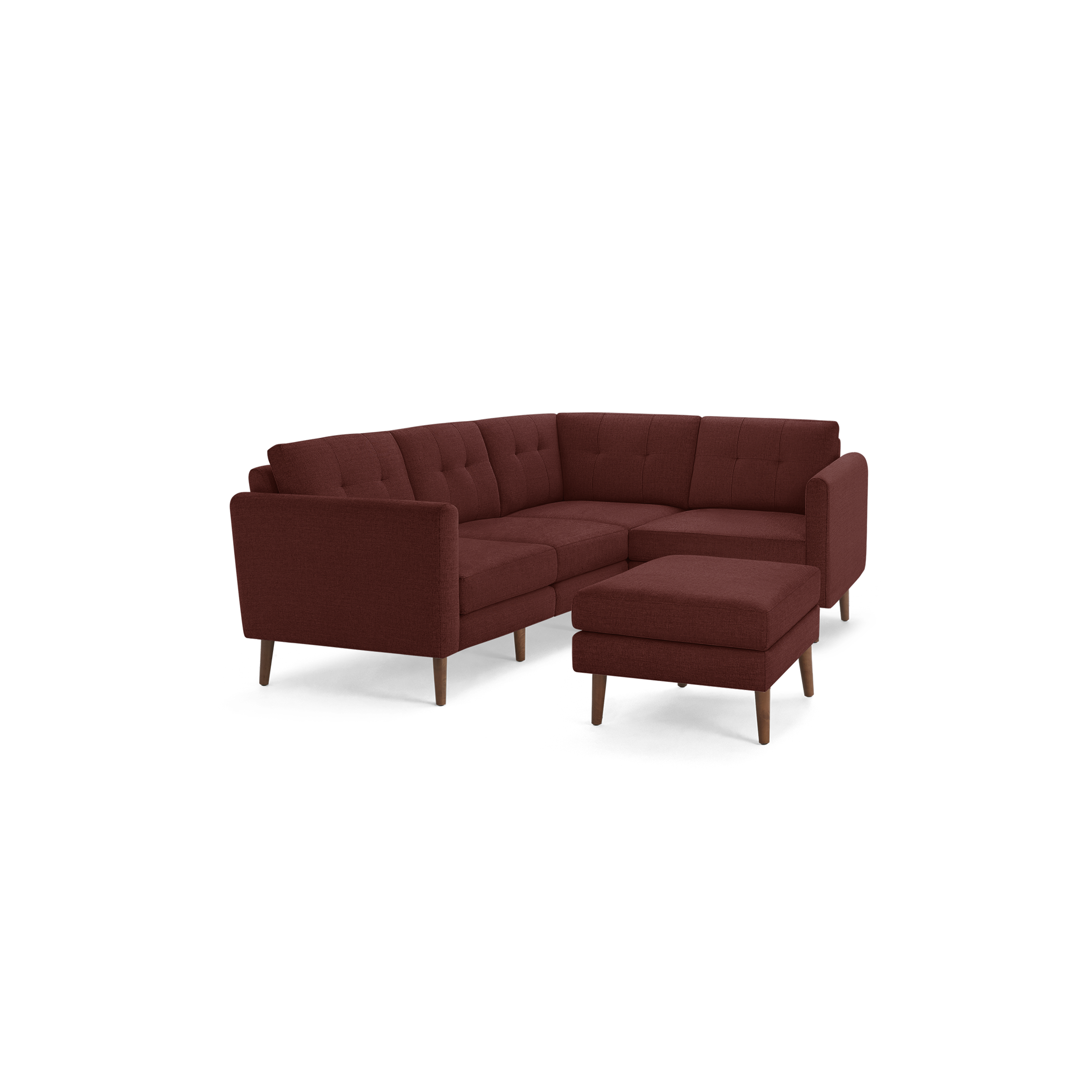 Mid-century modern L-shaped sectional sofa in deep red fabric with tufted back cushions and matching ottoman on wooden legs.