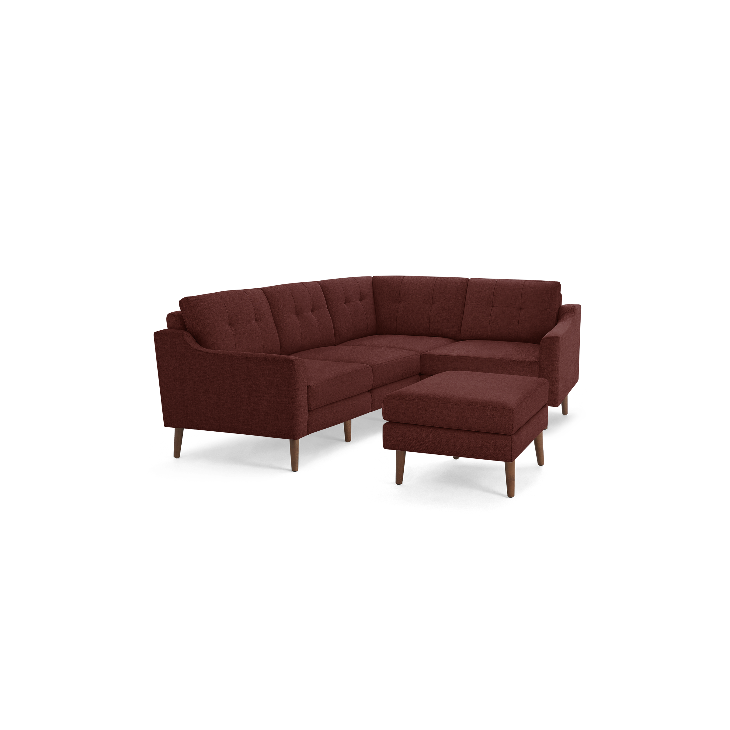 Modern L-shaped sectional sofa in deep red fabric with tufted back cushions and matching ottoman on wooden legs.