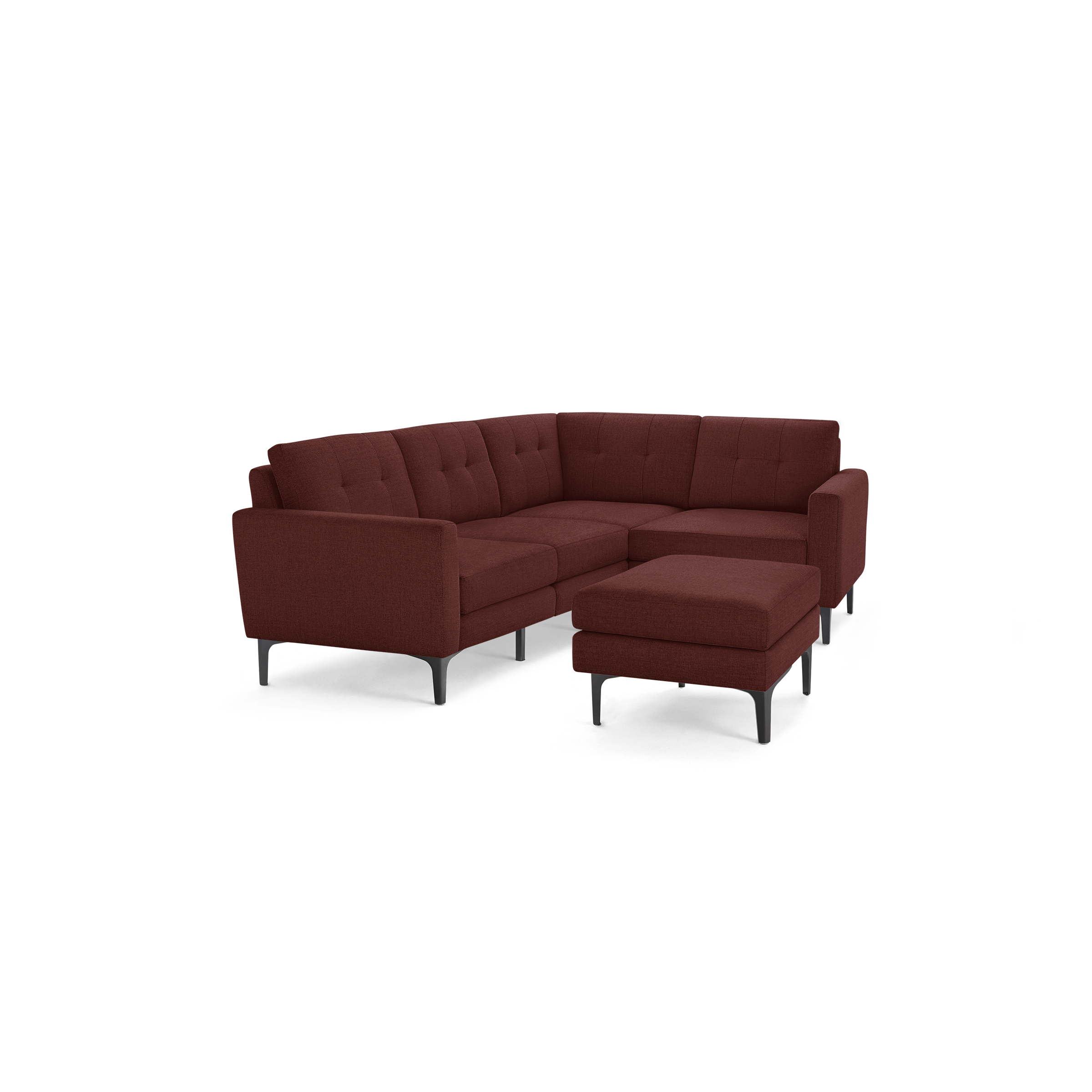 Maroon fabric upholstered L-shaped sectional sofa with tufted cushions and matching ottoman on black angled legs.