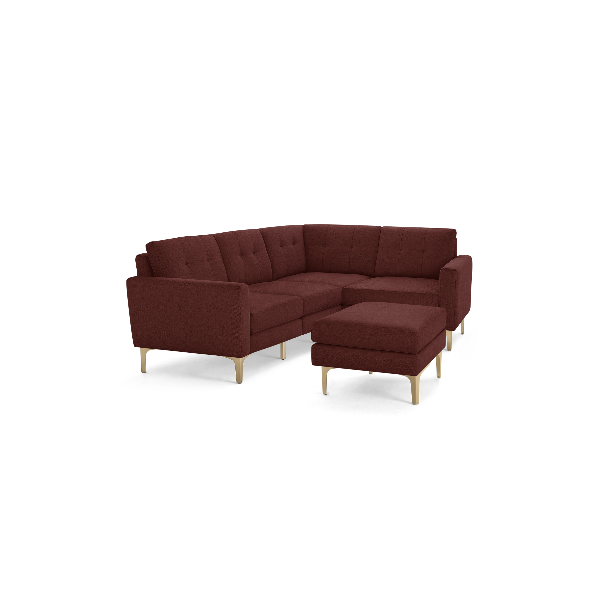 Modern L-shaped sectional sofa in deep red fabric with tufted cushions and light wooden legs, featuring a matching ottoman.
