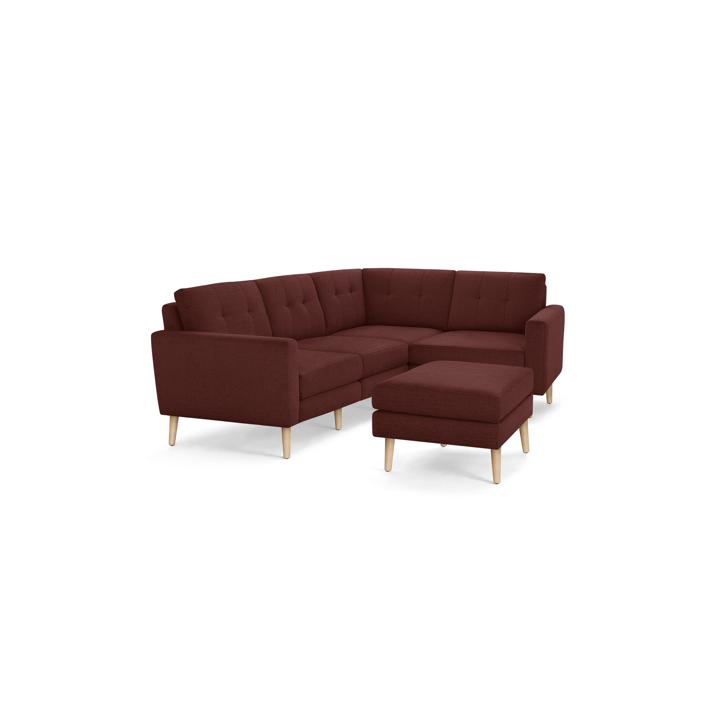 Maroon L-shaped sectional sofa with tufted cushions and wooden legs, featuring a matching square ottoman.