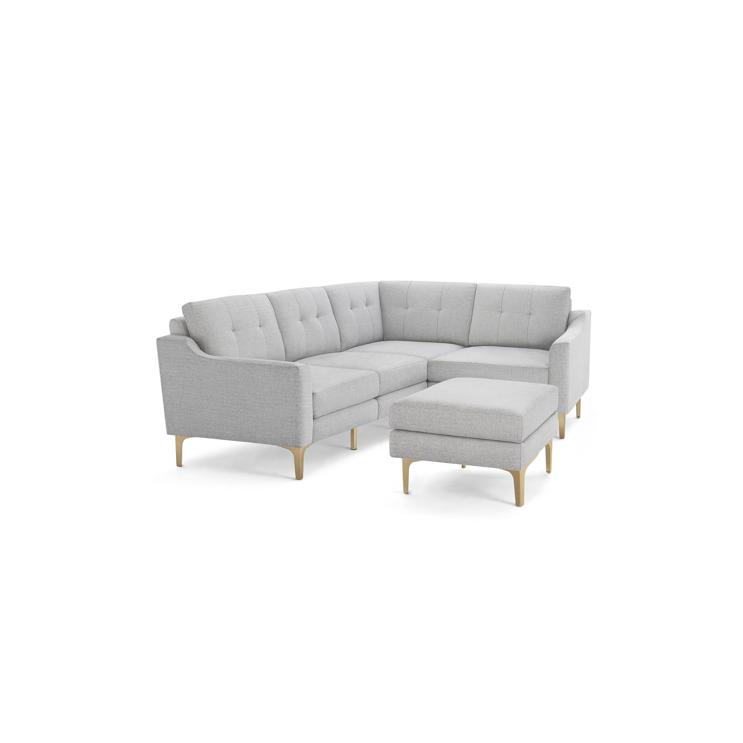 Light gray fabric sectional sofa with tufted back cushions, wooden legs, and matching ottoman.