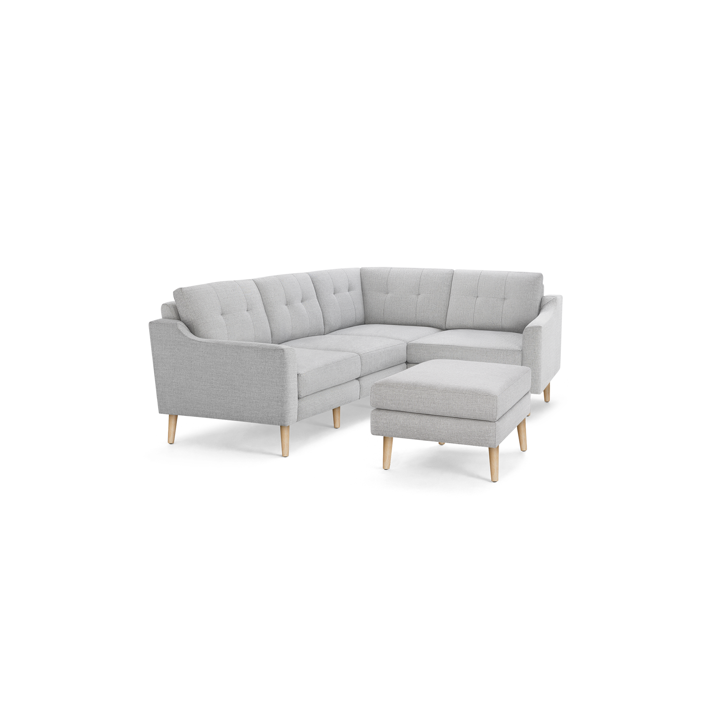 Light gray fabric sectional sofa with tufted back cushions, wooden legs, and matching ottoman, shown on white background.
