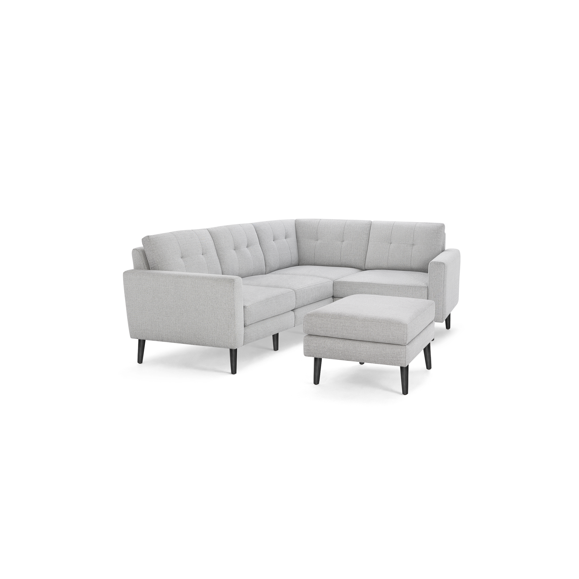 Light gray L-shaped sectional sofa with tufted cushions and matching ottoman, featuring black tapered wooden legs.