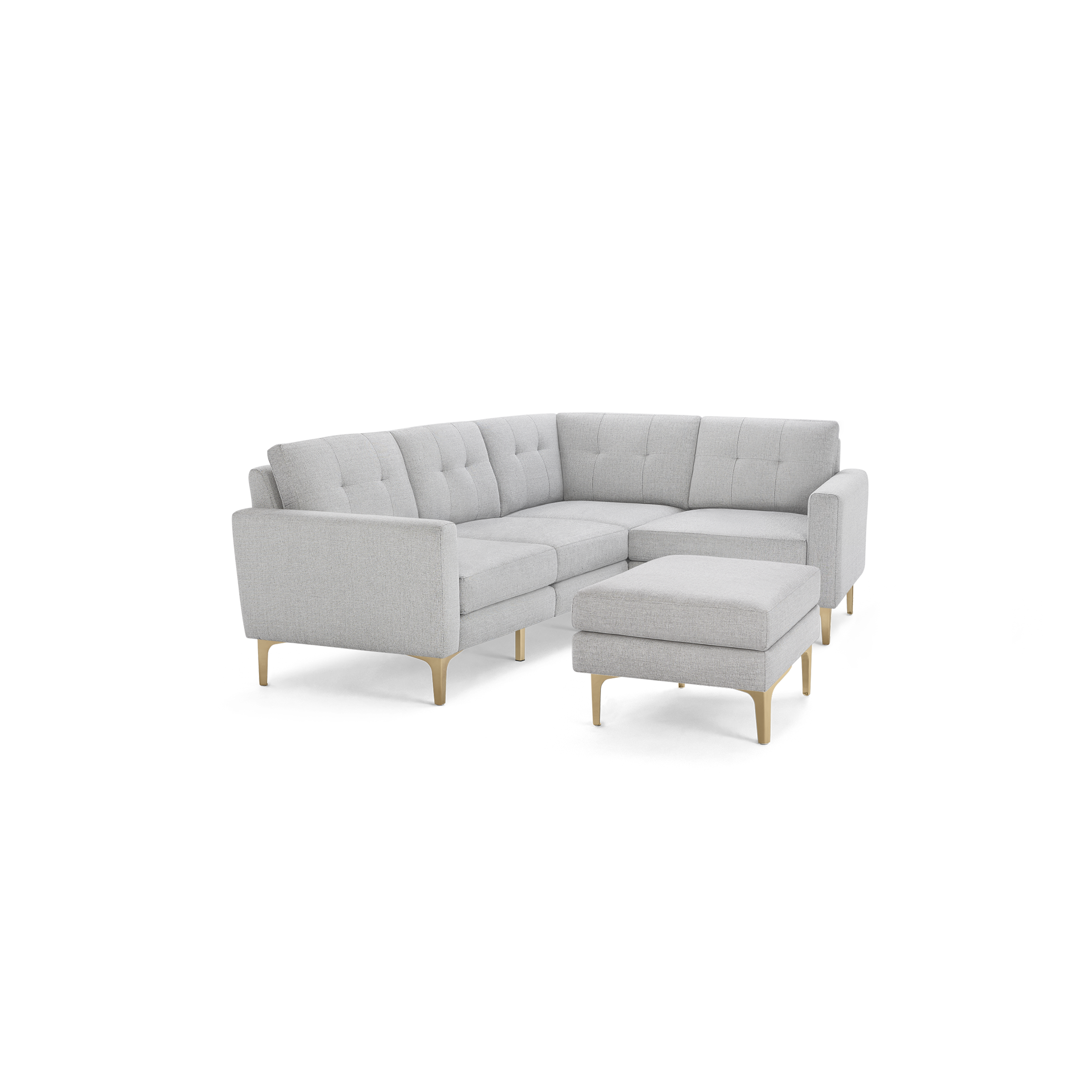 Light gray fabric sectional sofa with tufted cushions and wooden legs, including a matching ottoman.