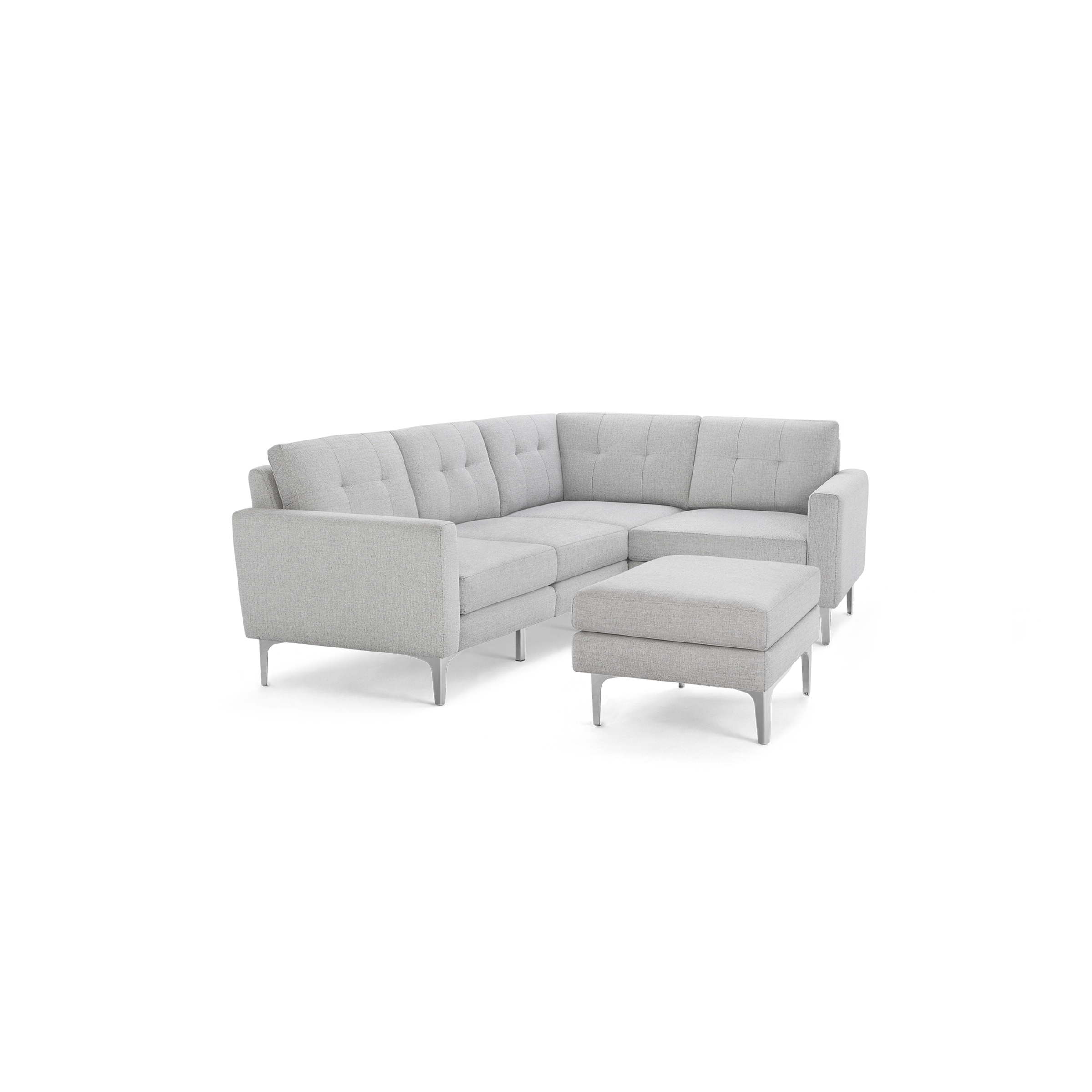 Light gray L-shaped sectional sofa with tufted back cushions and matching ottoman, supported by slim metal legs.