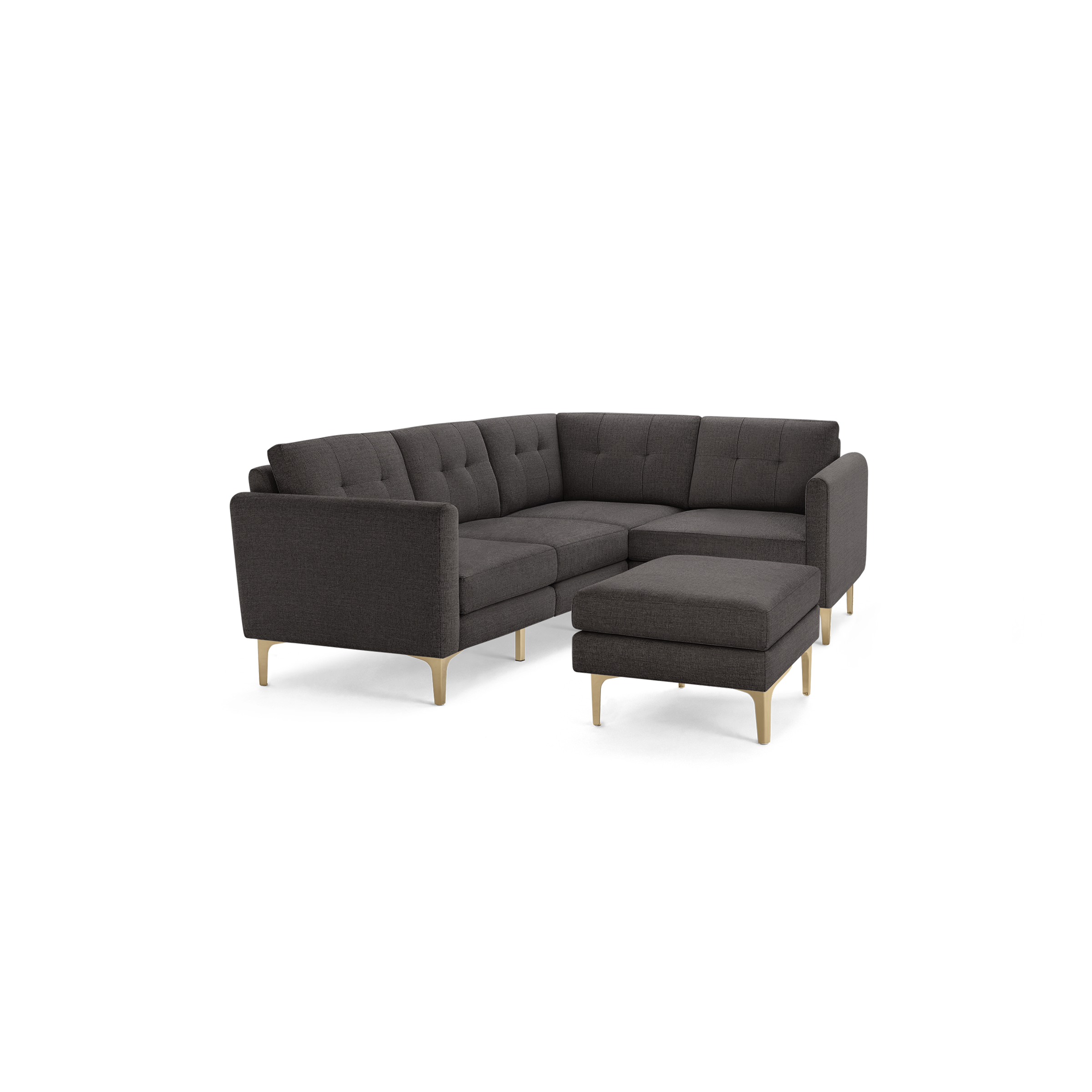 Dark gray modern L-shaped sectional sofa with tufted cushions, wooden legs, and matching ottoman on black background.
