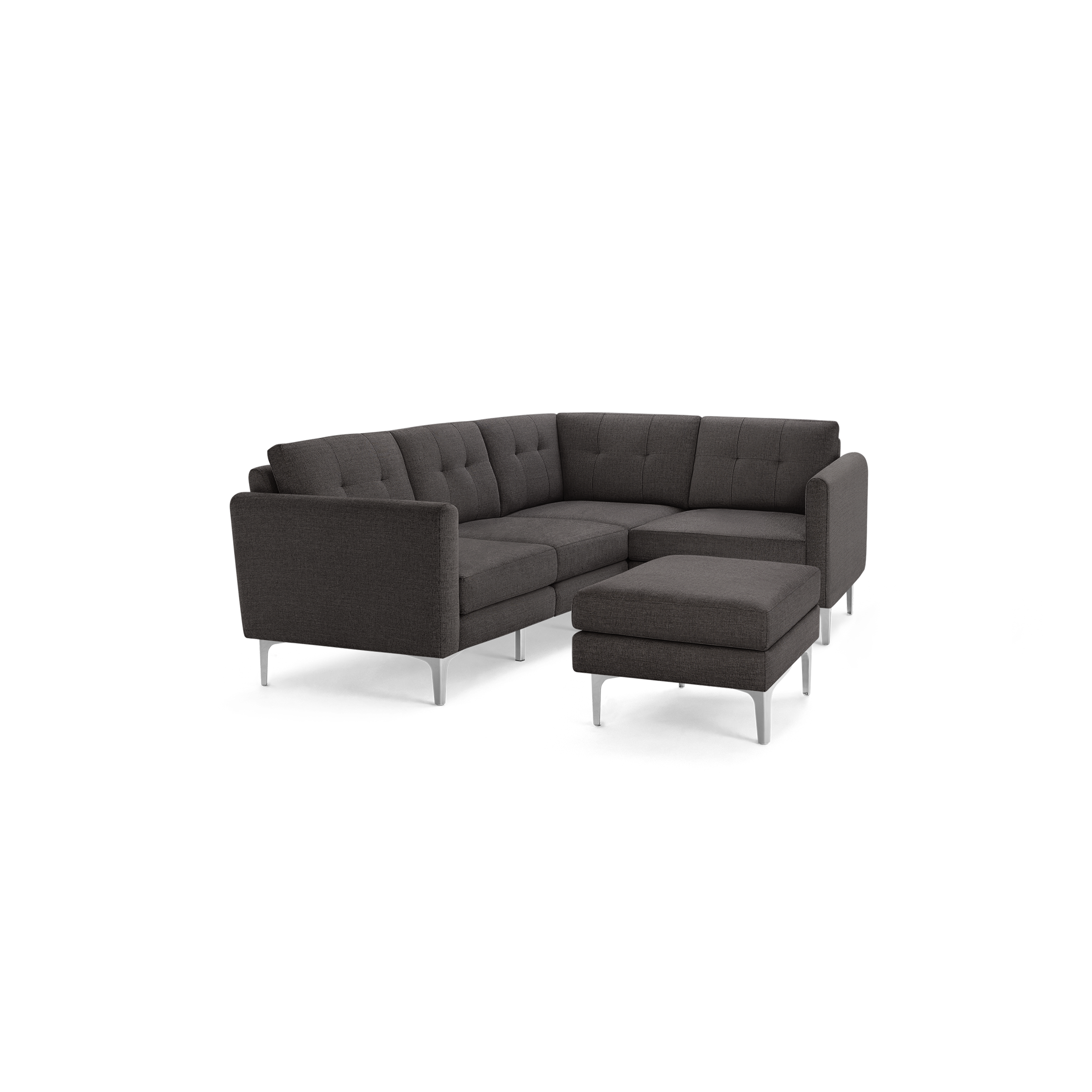 Dark gray fabric L-shaped sectional sofa with tufted back cushions and matching ottoman on silver metal legs.