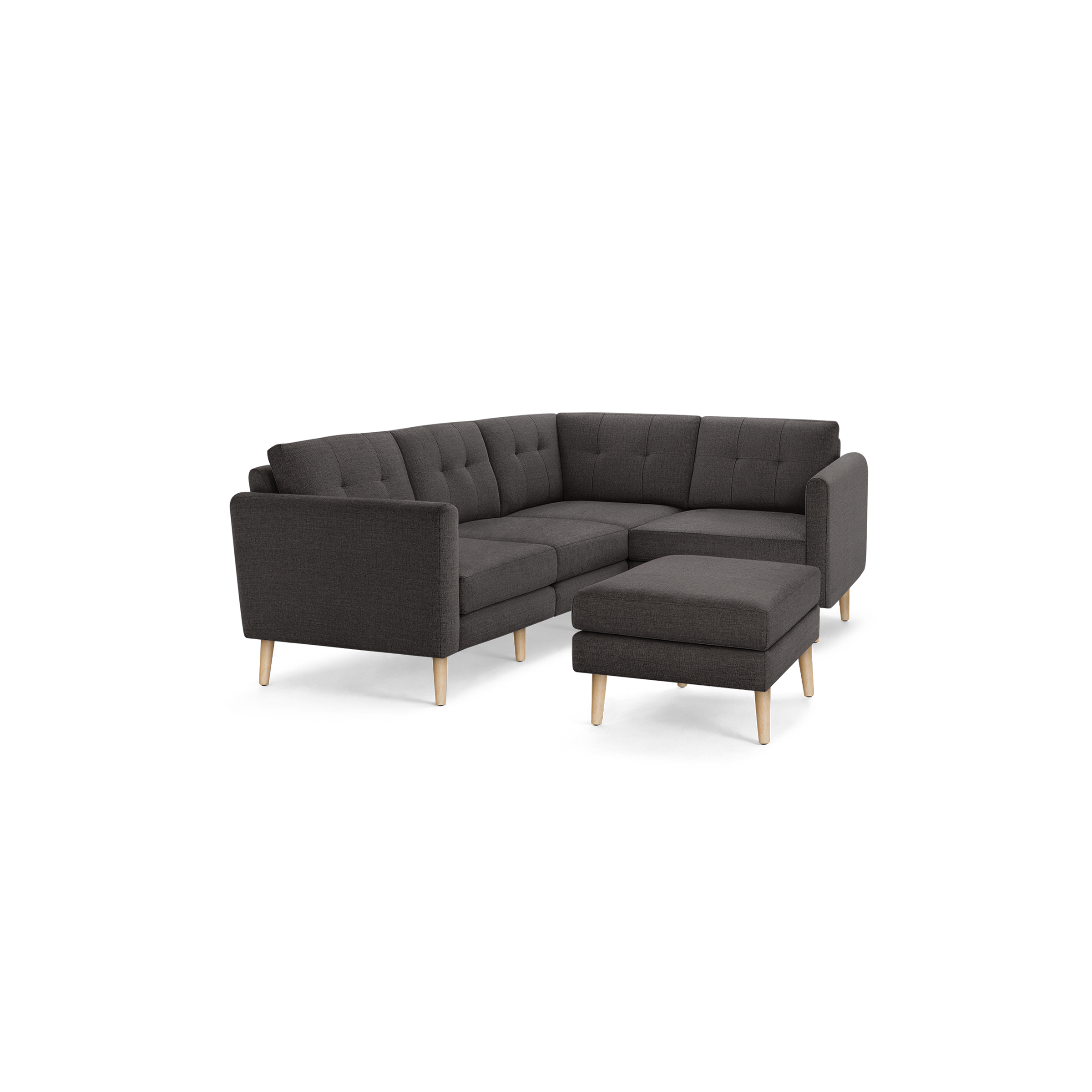 Dark gray modern sectional sofa with tufted cushions and light wooden legs, paired with a matching ottoman.