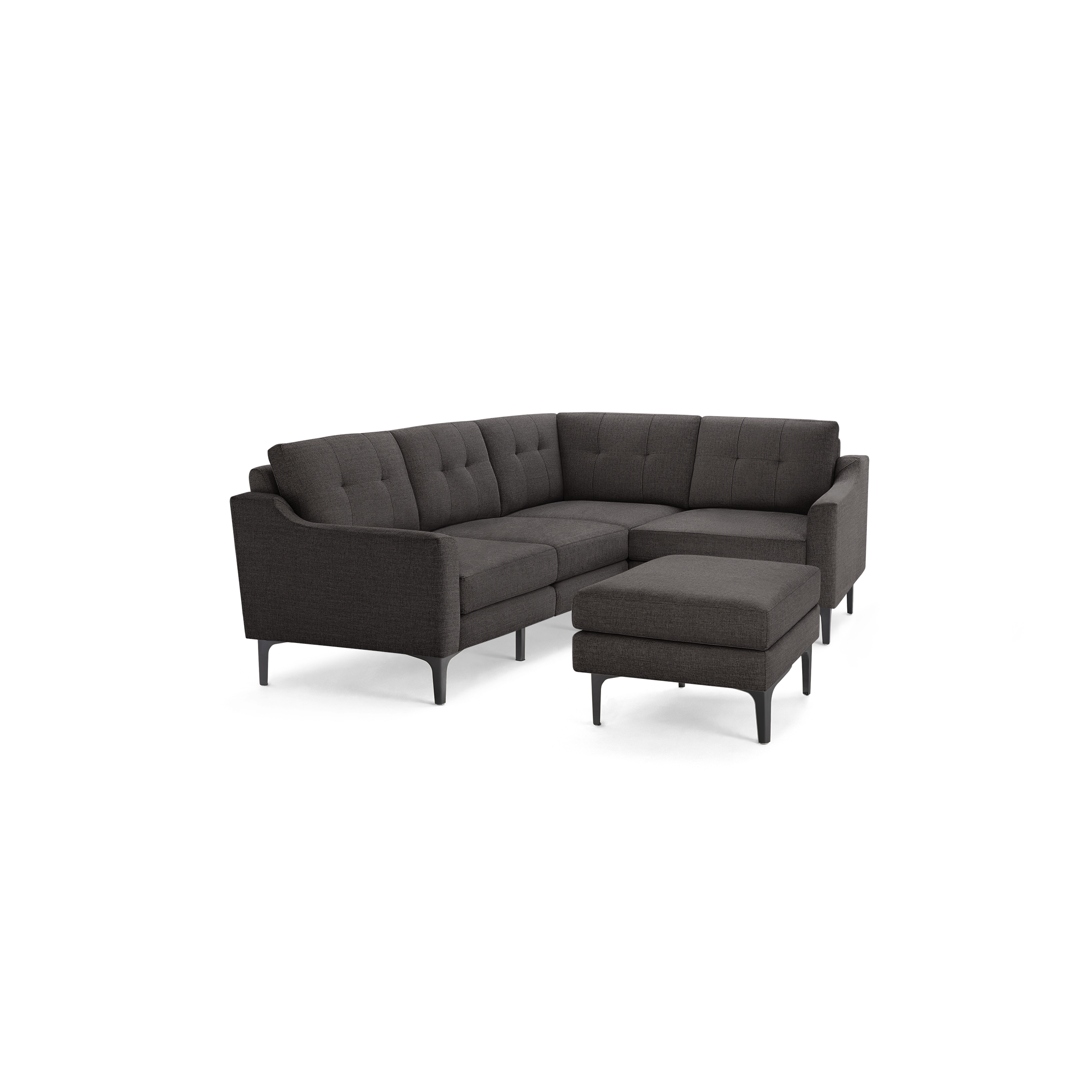 Dark gray L-shaped sectional sofa with tufted back cushions and matching ottoman, supported by slim black legs.
