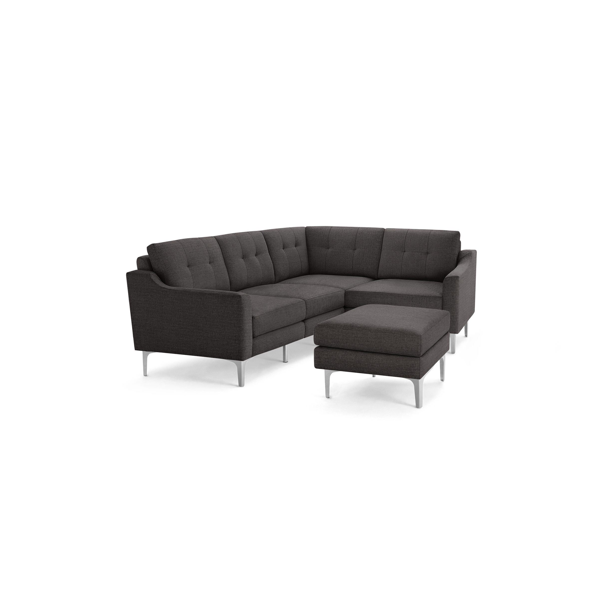 Dark gray fabric sectional sofa with tufted back cushions and matching ottoman, featuring sleek silver metal legs.