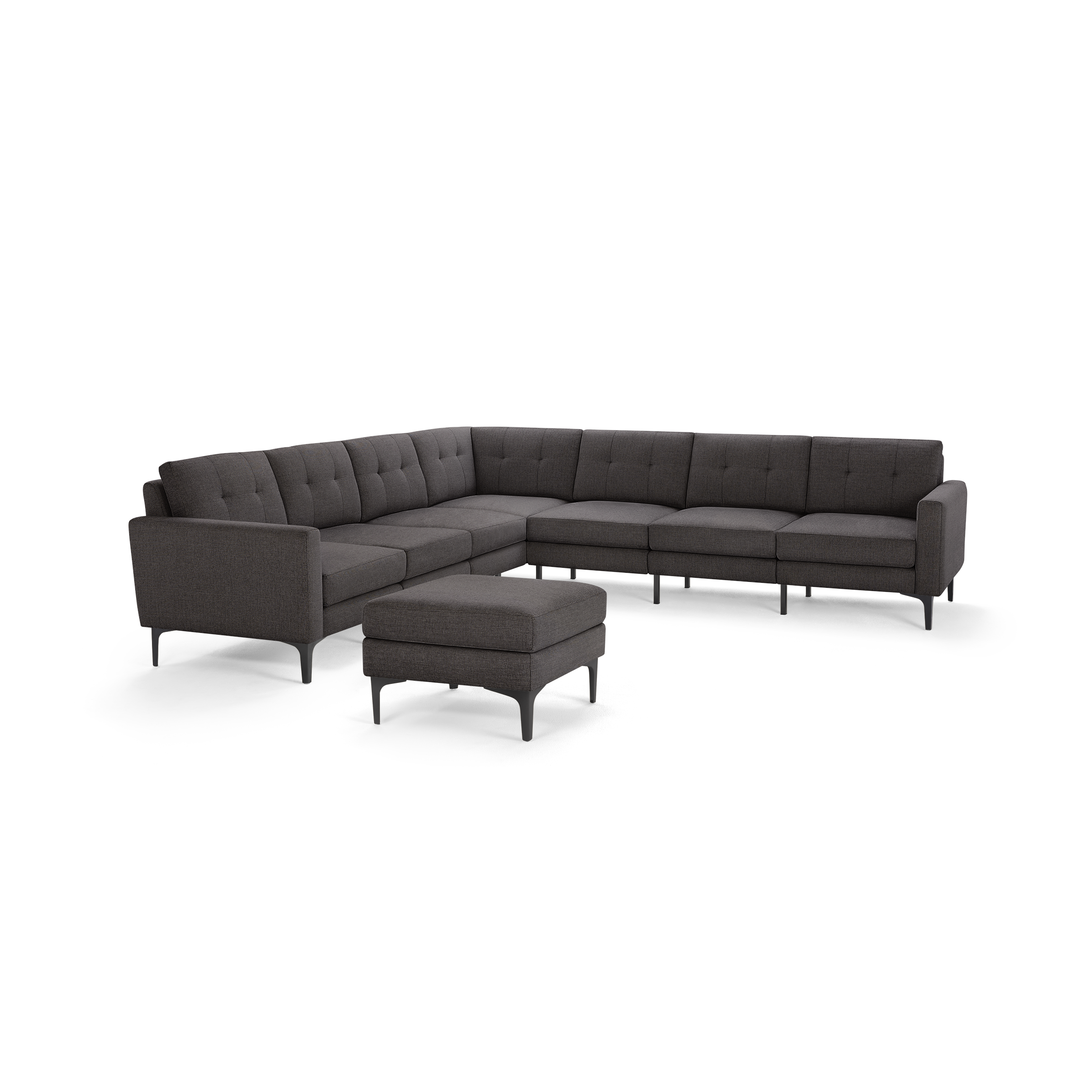 Dark gray modern L-shaped sectional sofa with tufted cushions and matching ottoman, featuring slim black metal legs.