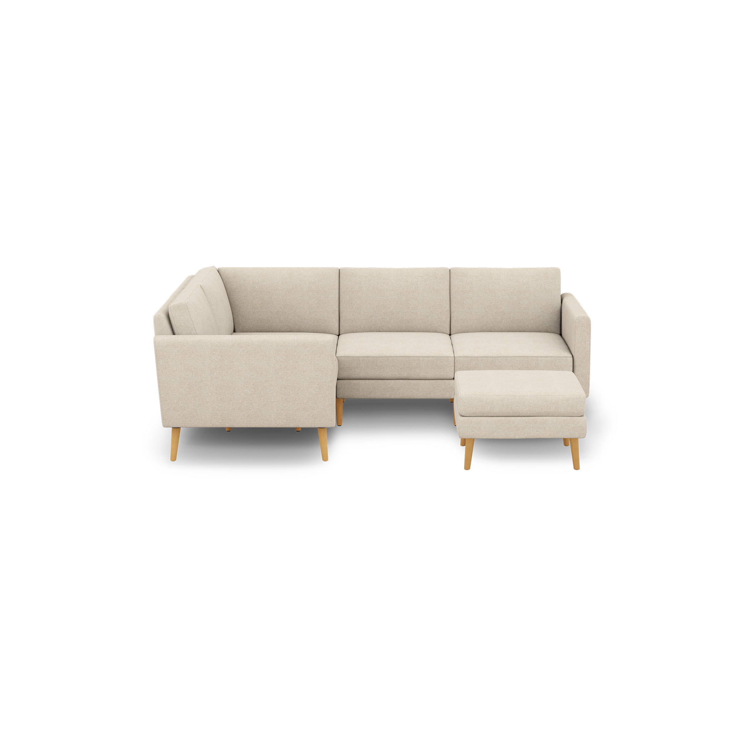 Beige fabric L-shaped sectional sofa with wooden tapered legs, featuring three seat cushions and an ottoman on the right side.