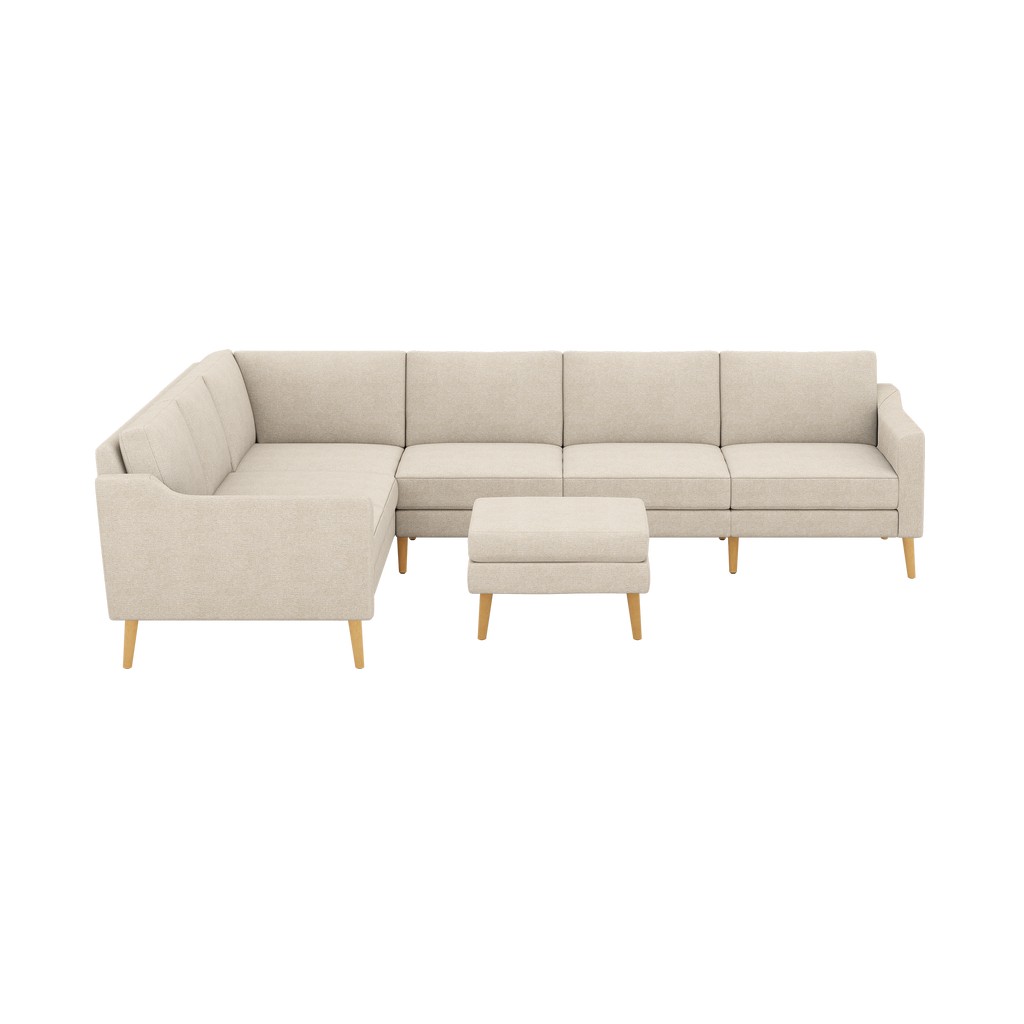 Beige L-shaped sectional sofa with matching ottoman, featuring clean lines and wooden tapered legs.