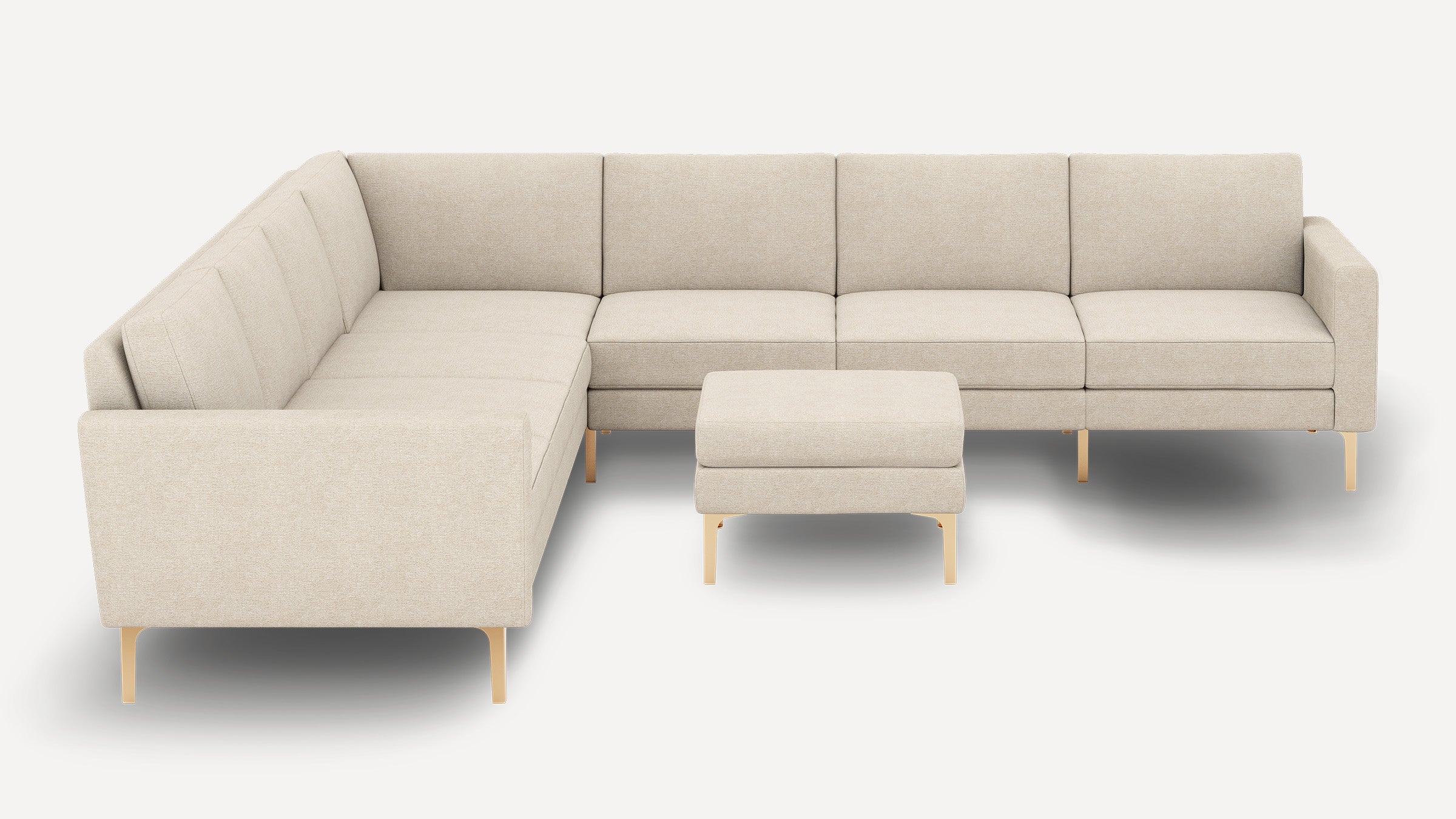 Beige L-shaped sectional sofa with clean lines, plush cushions, and matching ottoman supported by sleek wooden legs.