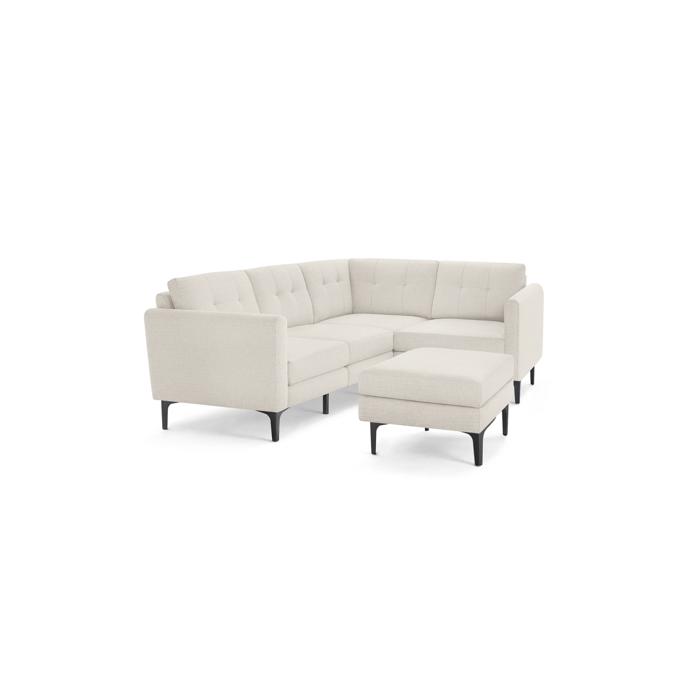Modern L-shaped beige sectional sofa with tufted cushions and slim black metal legs, including a matching ottoman.