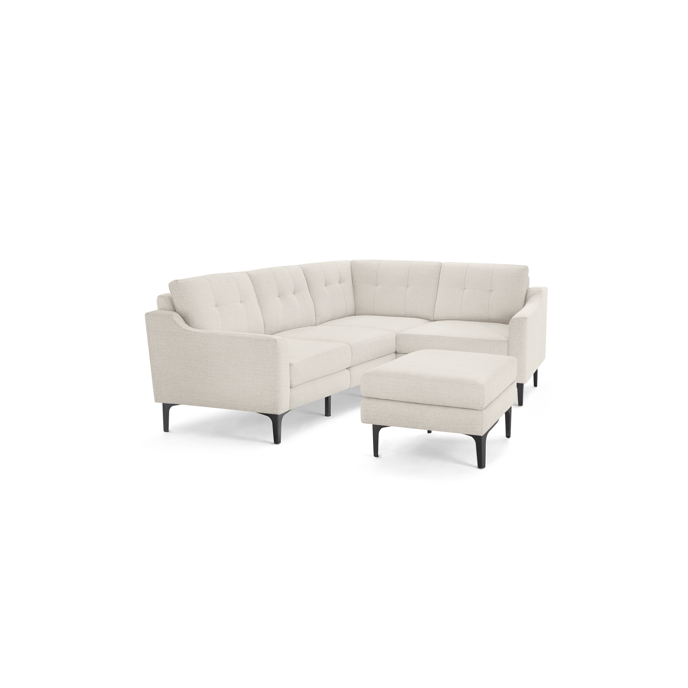 Beige fabric sectional sofa with tufted back cushions and a matching ottoman, supported by black metal legs.