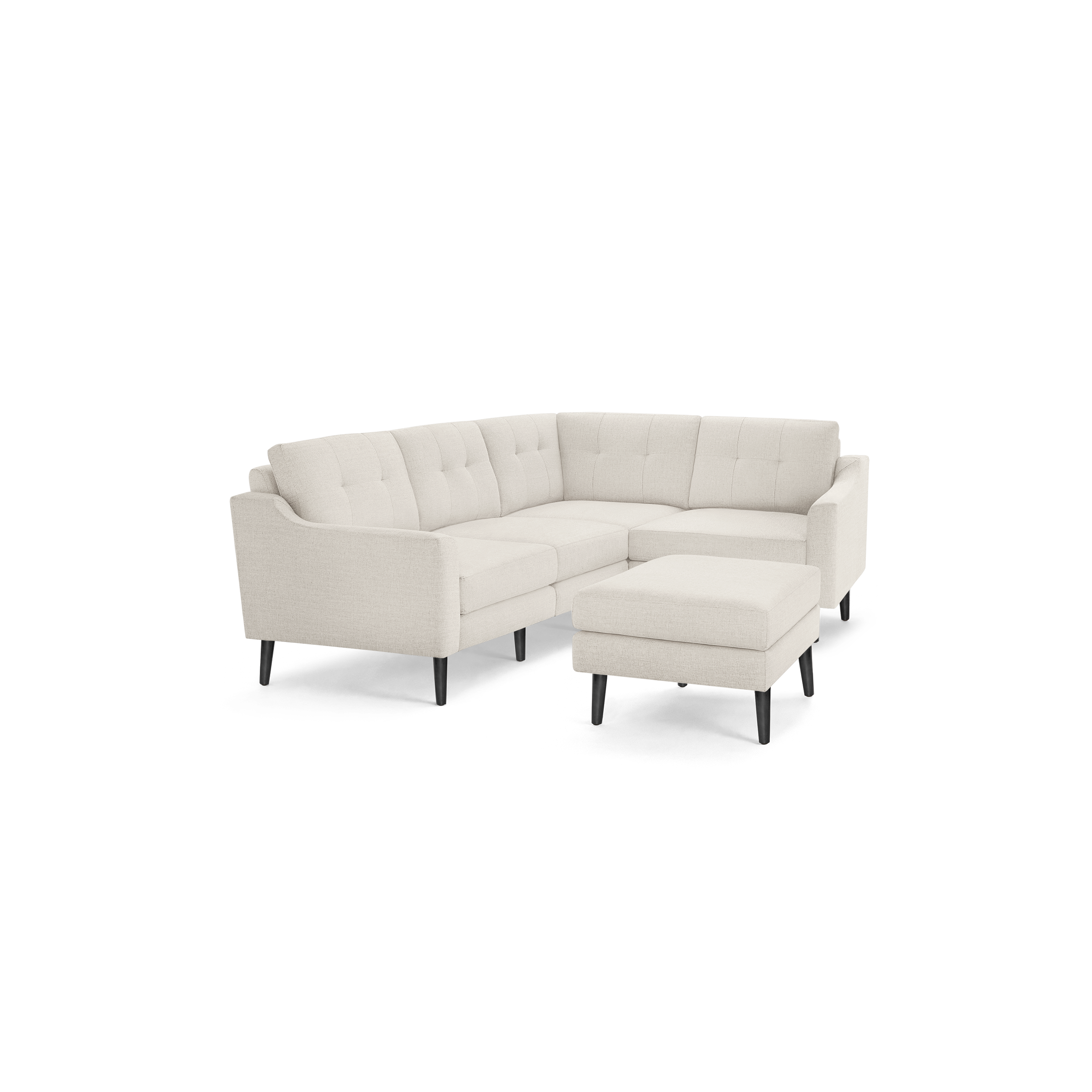 Beige upholstered modern sectional sofa with tufted back cushions, black tapered wooden legs, and matching ottoman.