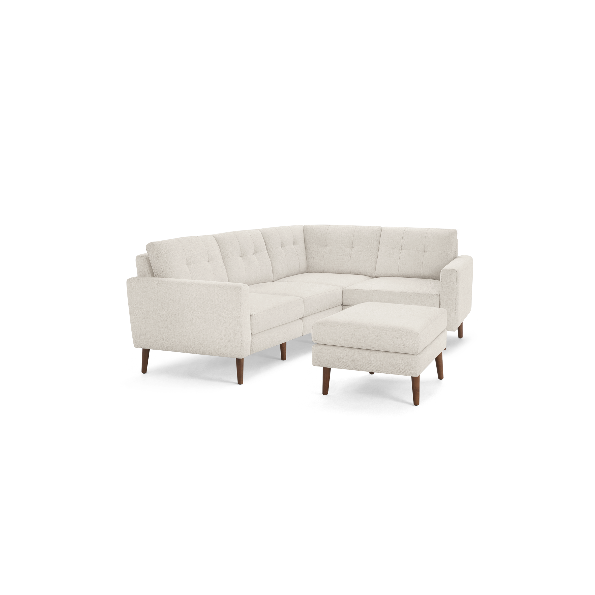 Beige fabric tufted L-shaped sectional sofa with wooden legs and matching ottoman, featuring modern mid-century design.