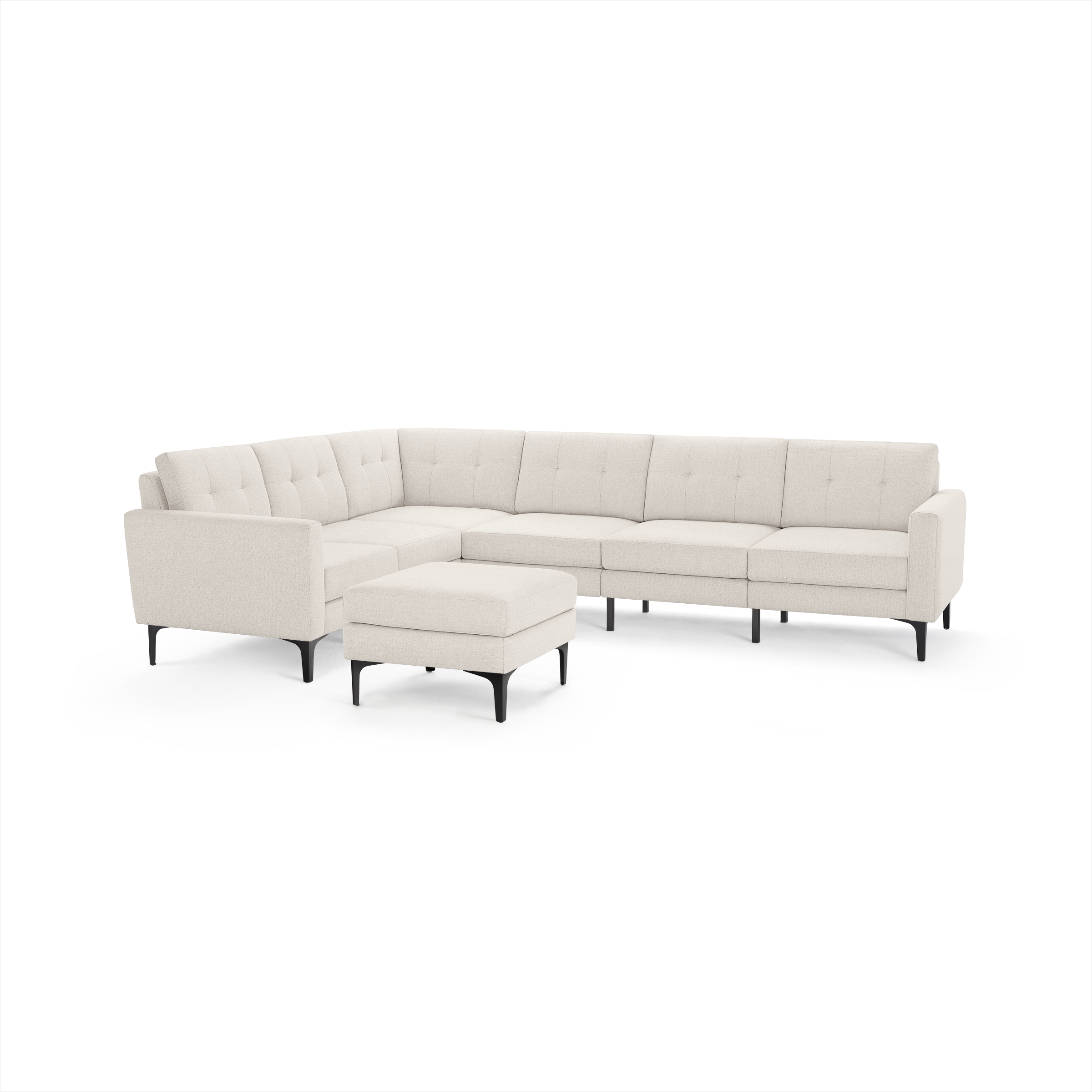 Modern beige L-shaped sectional sofa with tufted cushions and matching ottoman, featuring black tapered legs.