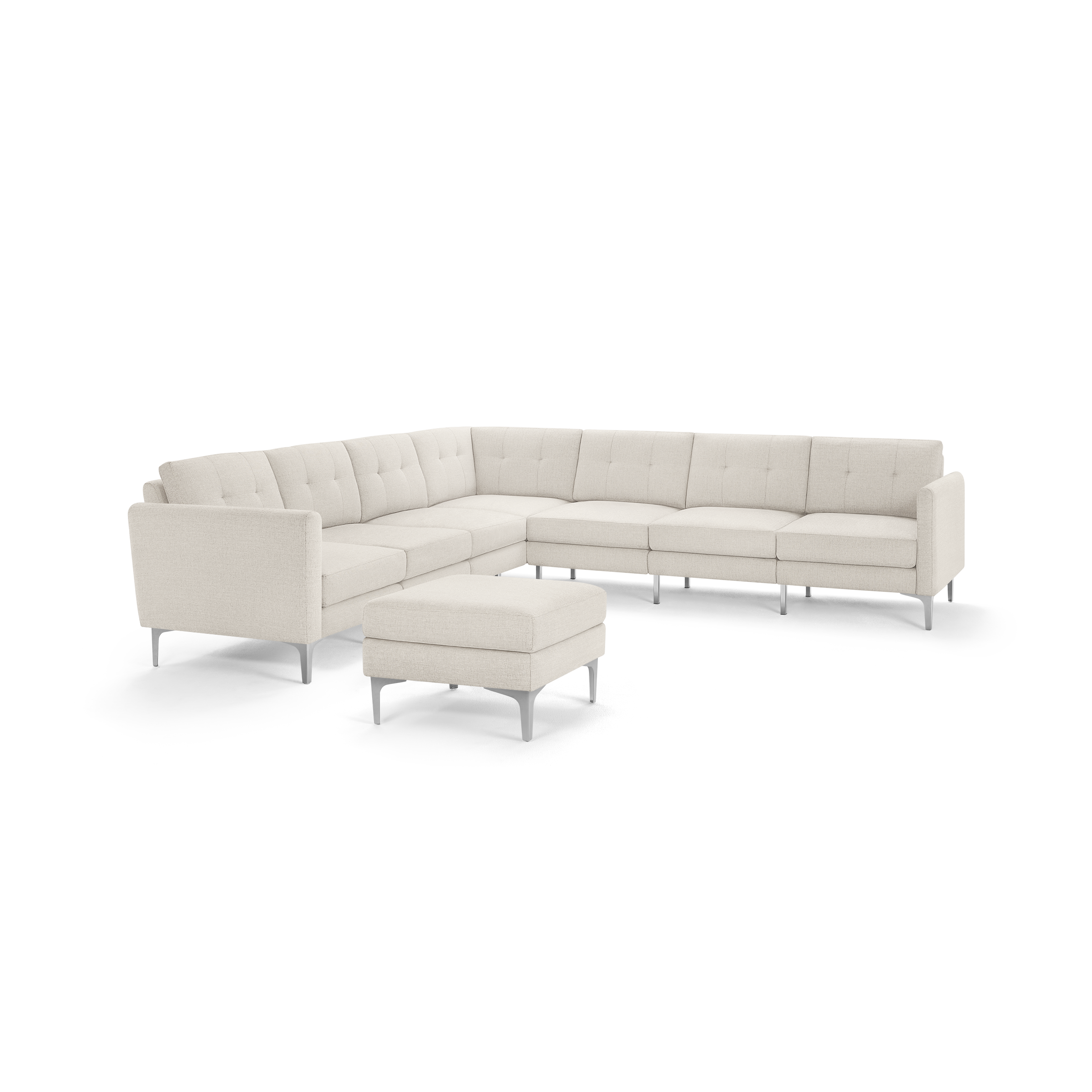 Beige modern L-shaped sectional sofa with tufted cushions and matching ottoman, supported by slim silver metal legs.