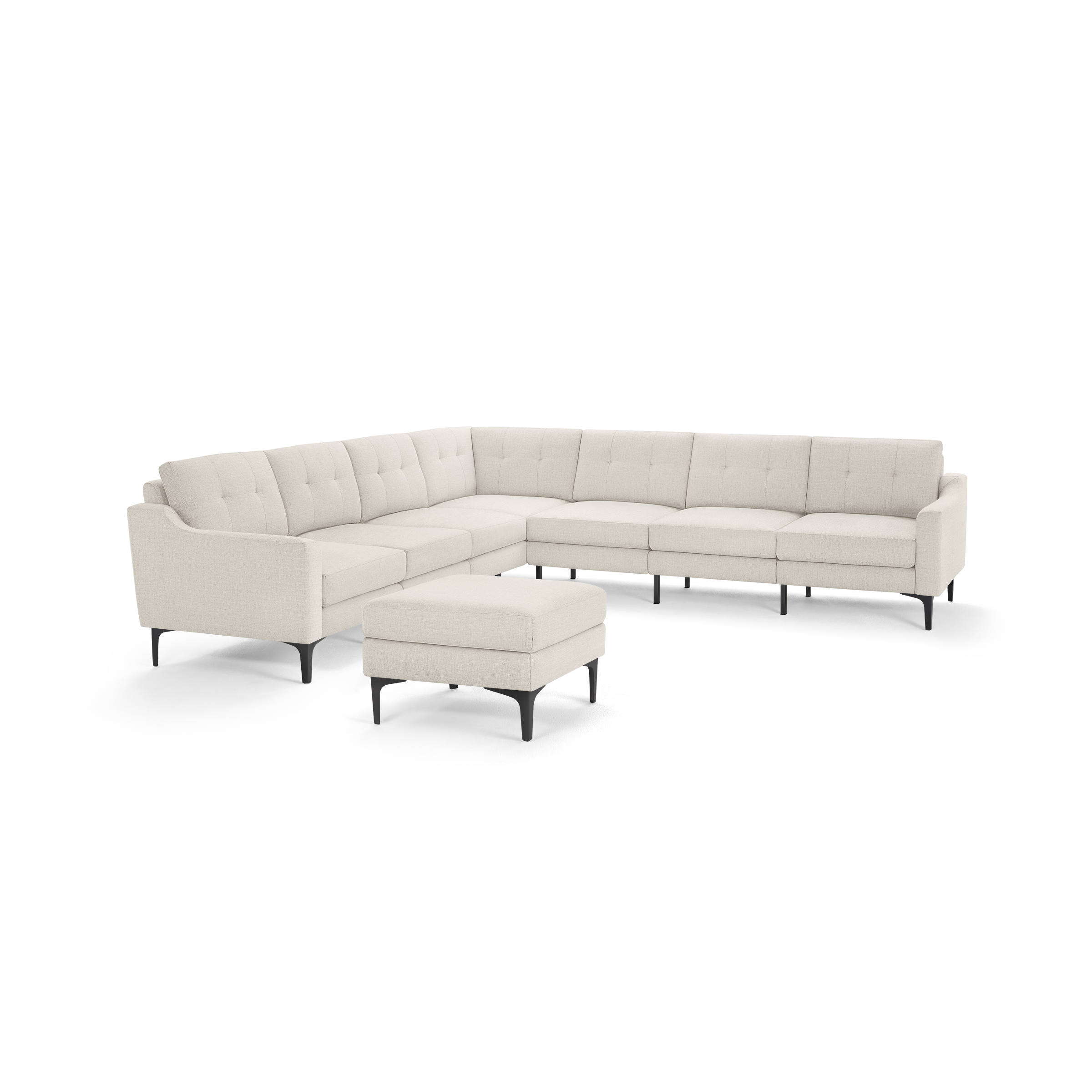 Beige fabric tufted L-shaped sectional sofa with slim black legs and matching ottoman on white background.