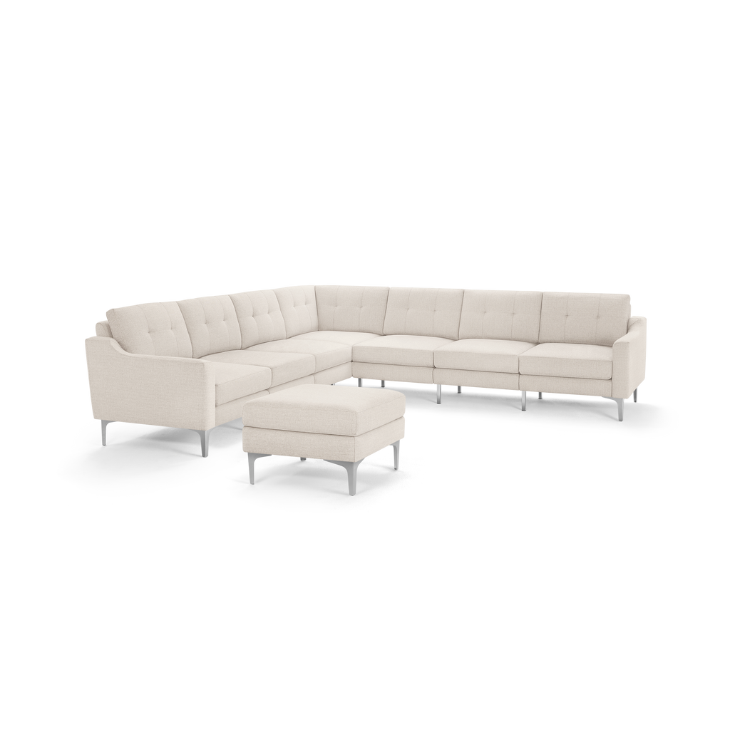 Light beige L-shaped sectional sofa with tufted cushions, metal legs, and matching ottoman, designed for modern living rooms.