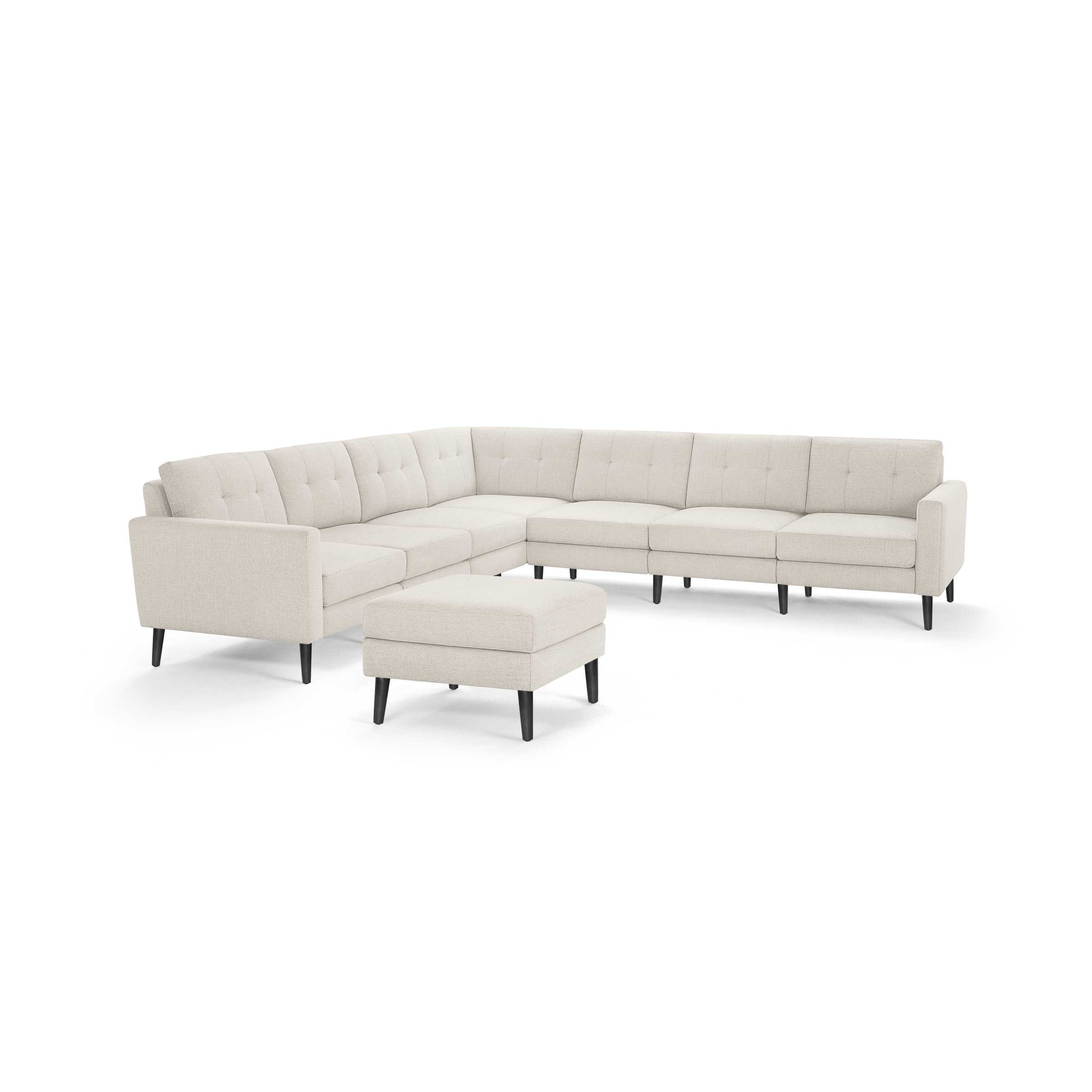 L-shaped beige tufted fabric sectional sofa with black tapered legs and matching square ottoman.